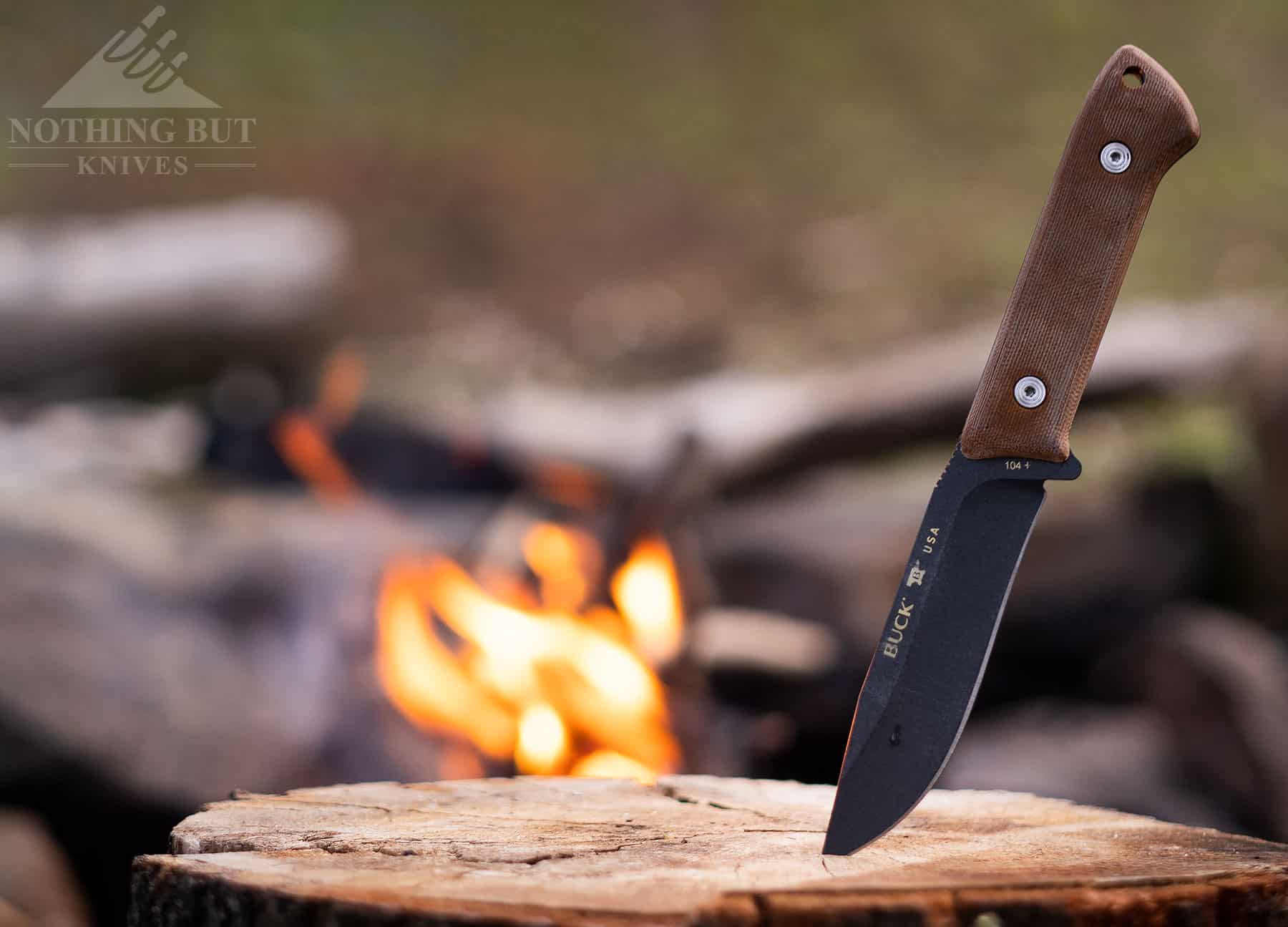 Buck Compadre fixed blade knife at a campsite. 