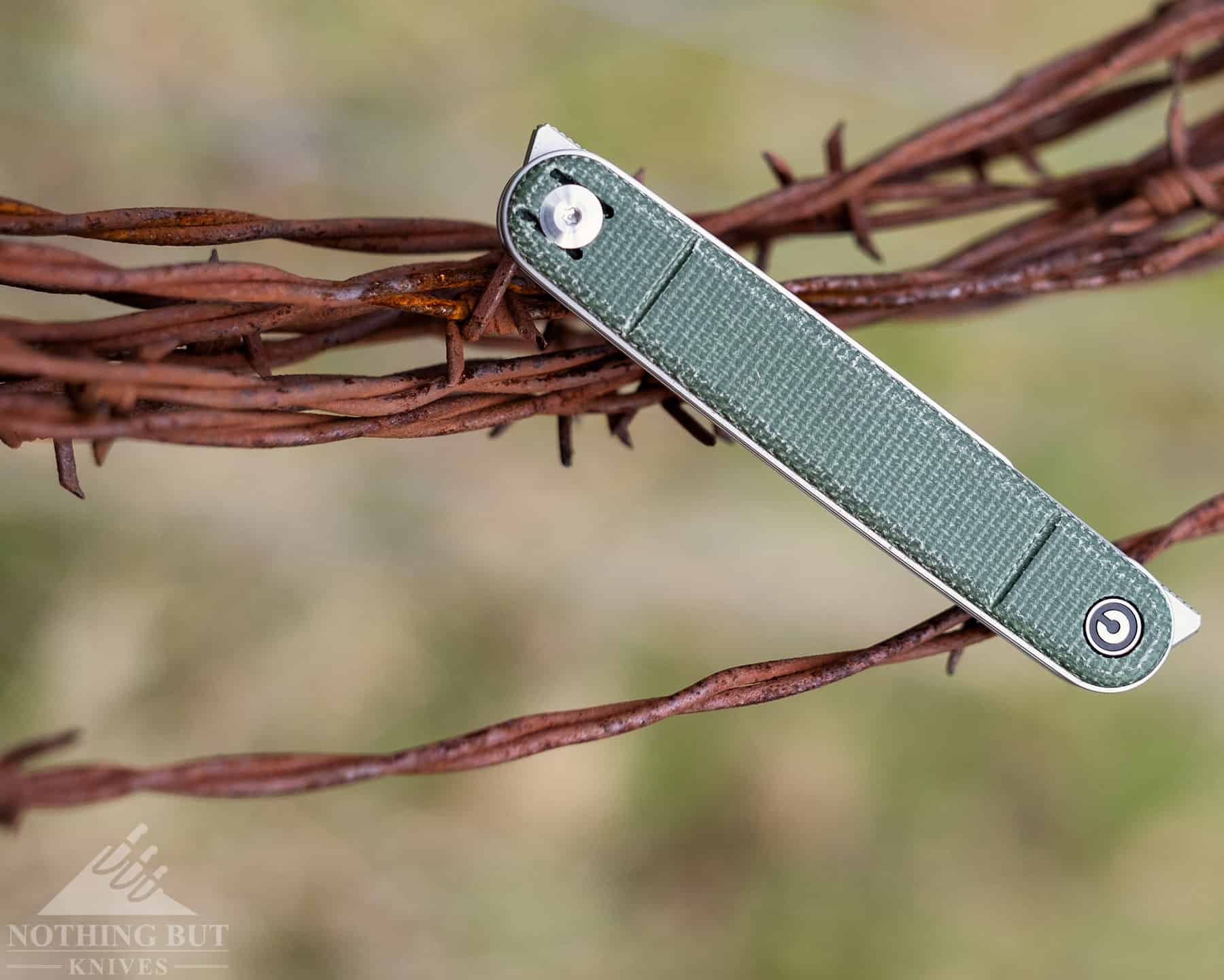 An image of the Civivi Crit folding knife with both blades closed to show the shape of the handle. 