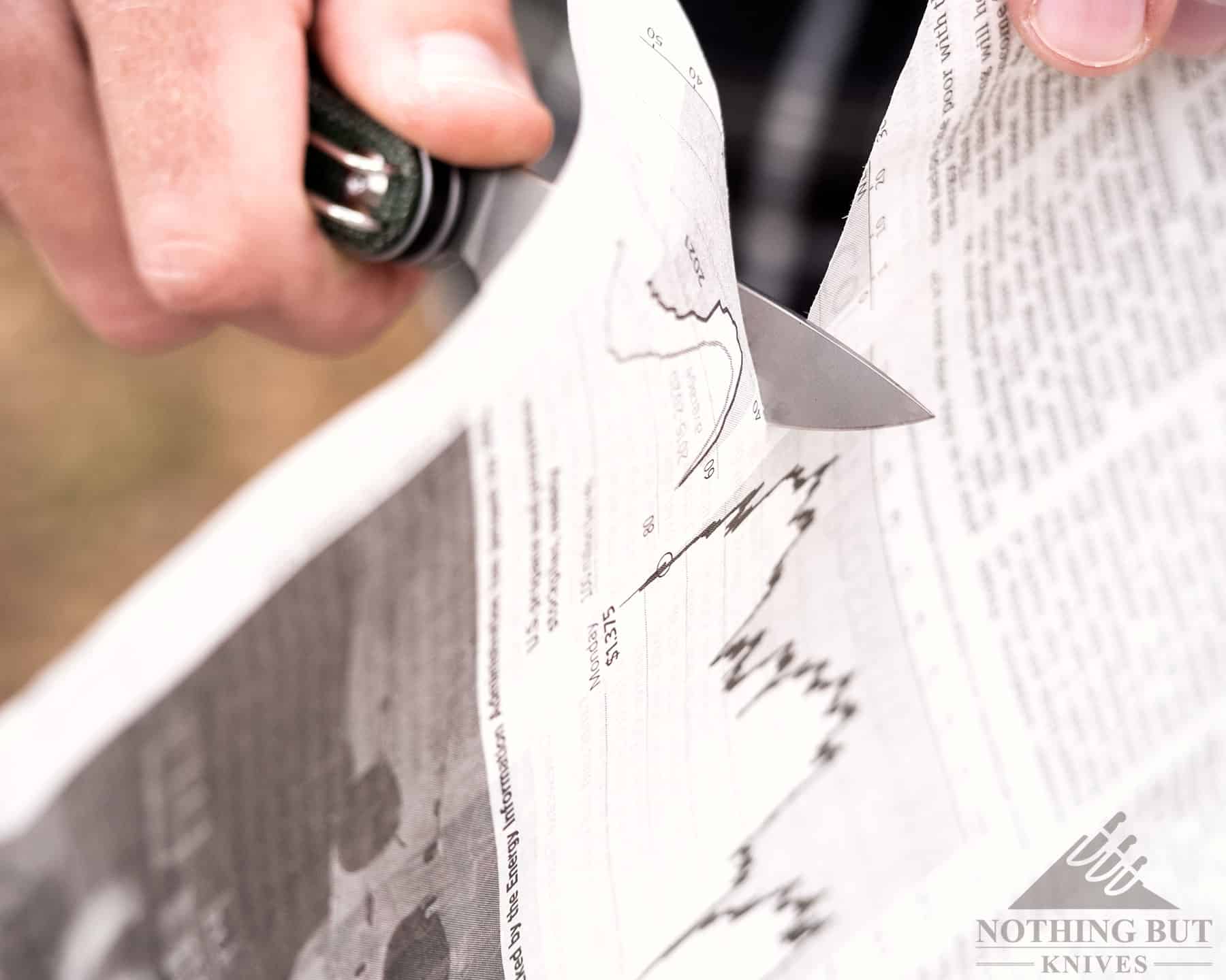 Civivi Crit Knife Review - Image 2 The Civivi Crit doing a paper test as part of our in-depth knife review.