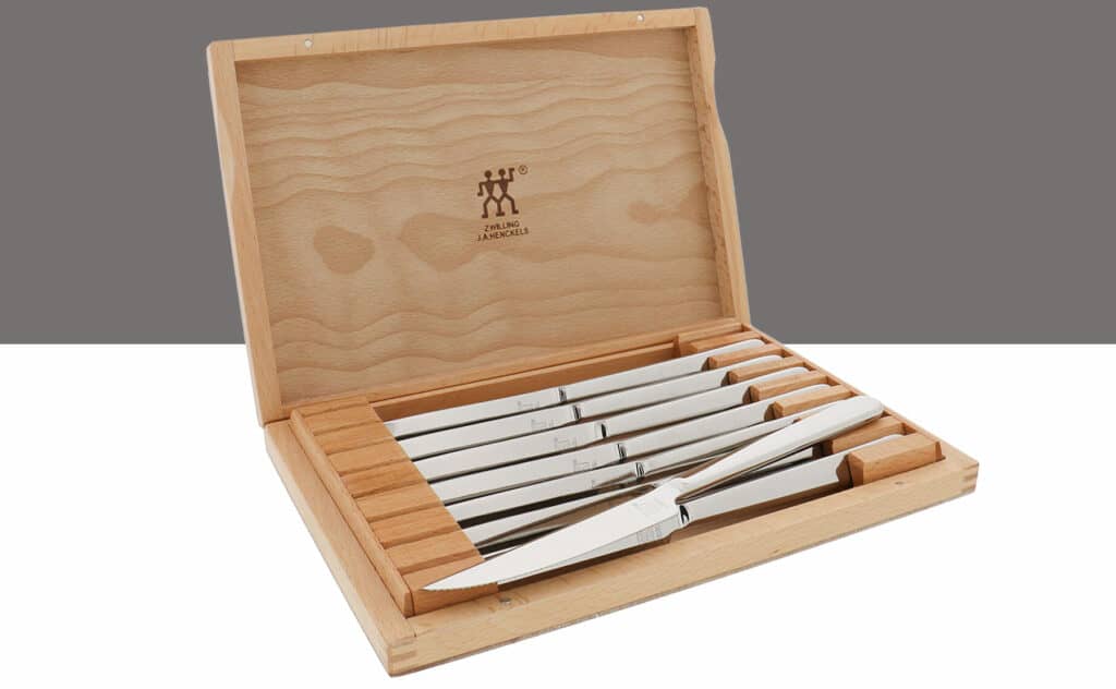 Zwilling Stainless Steel steak knife set shown here in it's wood storage box.