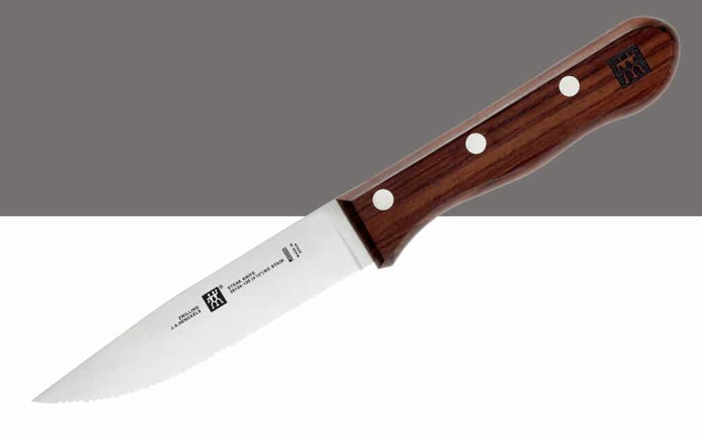 This graphic shows the wood handle and serrated blade of a Zwilling Steak House knife.