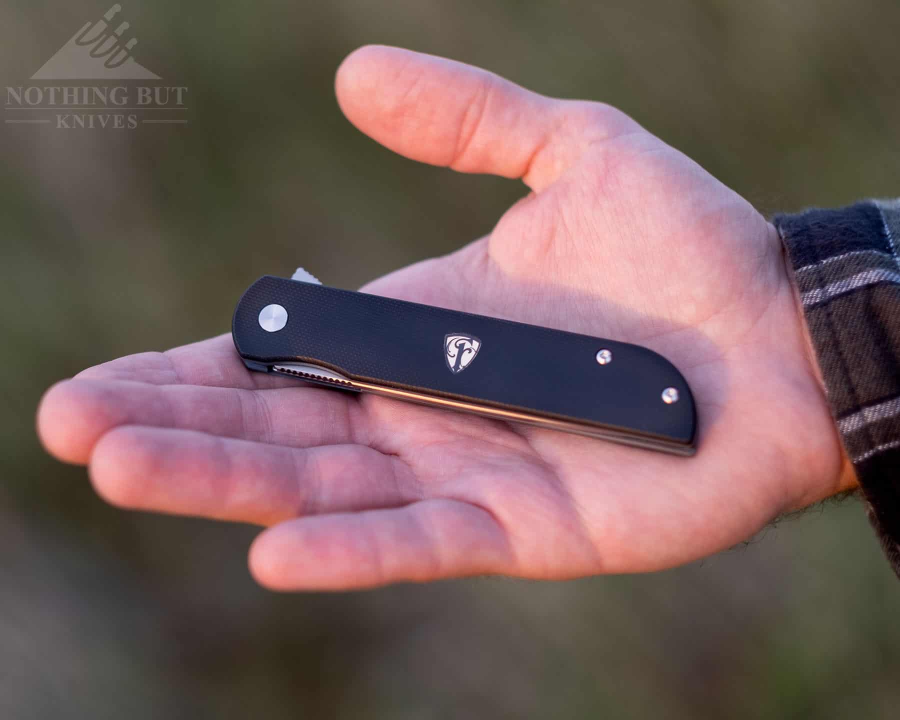 Finch Knife Co Cimarron Review - Image 2 The Finch Cimarron Gentleman's folder in closed position in the palm of a person's hand to show fit and finish quality.
