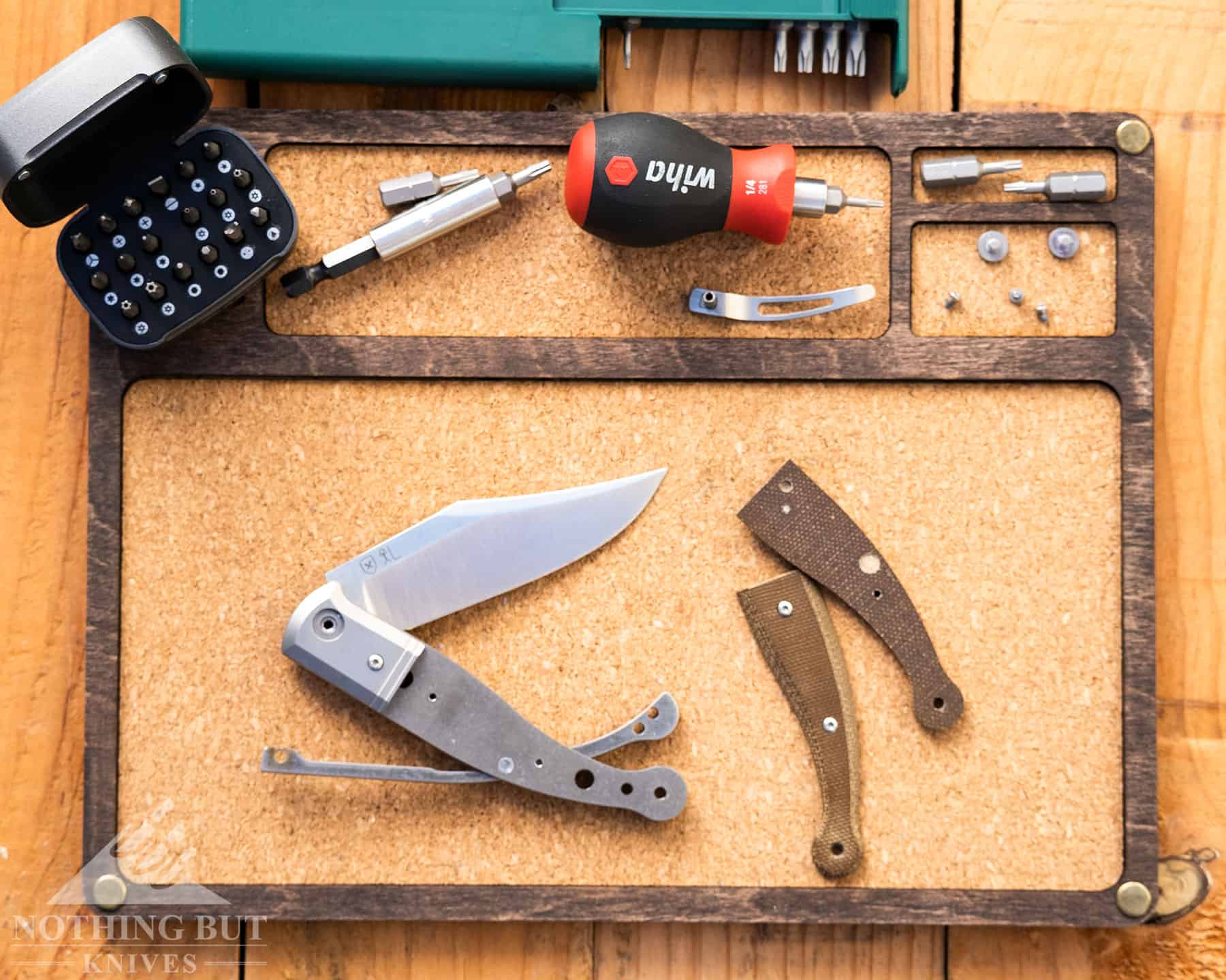A slip joint knife dismantled to show it's components separately. 