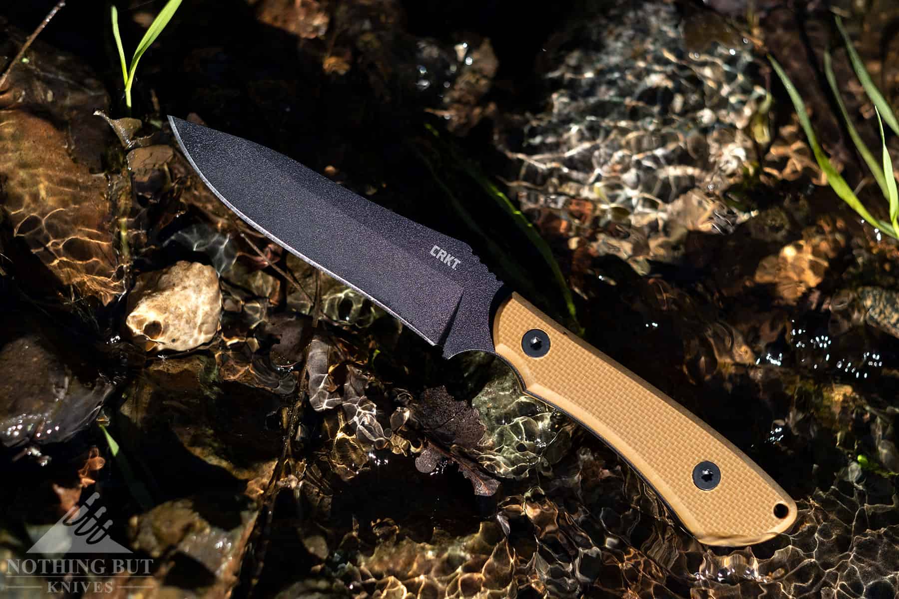 The CRKT Ramadi is a tactical, survival knife hybrid with a high carbon steel blade that holds it's edge really well. 