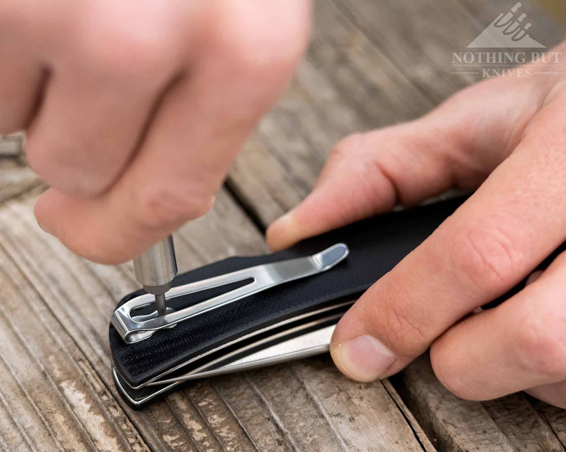 A close-up image that illustrates how to change the pocket clip from one side of the knife to the other.
