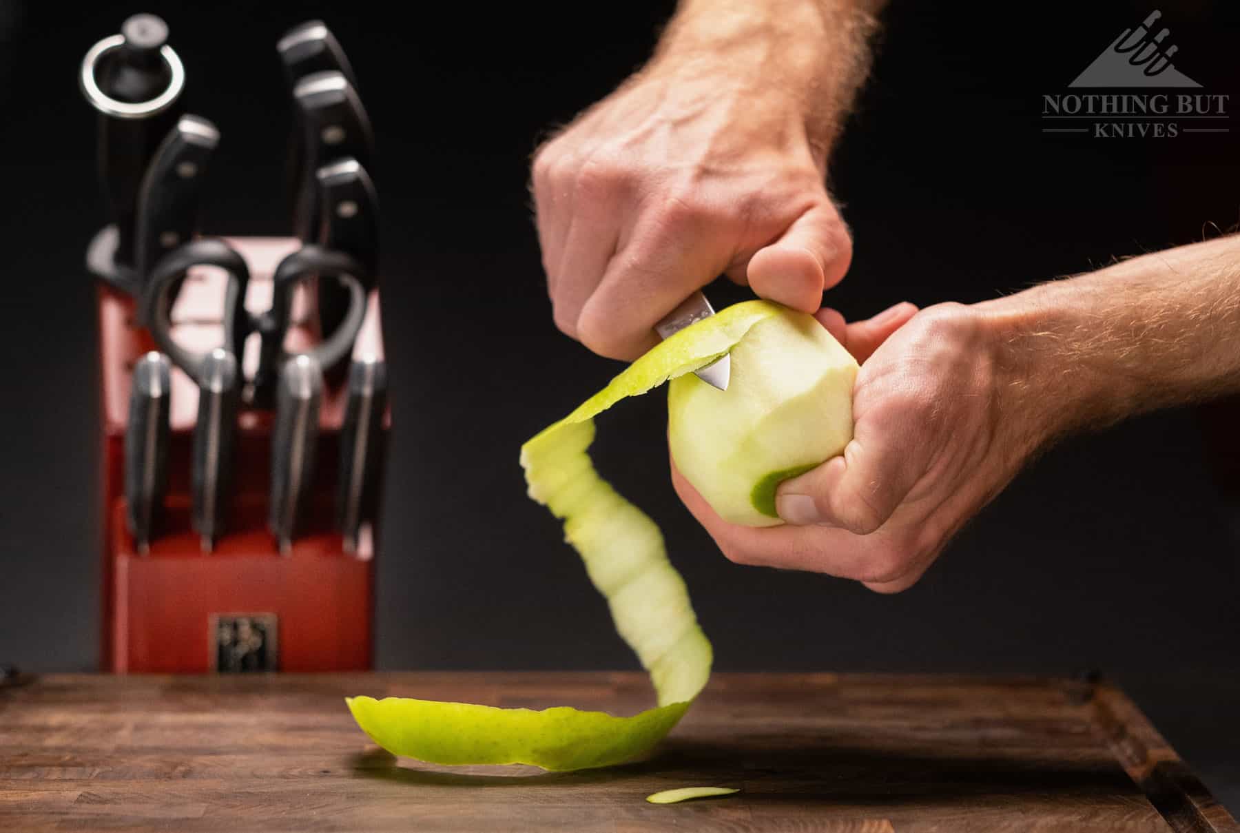 Best Kitchen Knife Sets Under $100 - 2023 Update 13 The well designed paring knife in this knife set was a little duller than the other knives, but is was still more than capable. It is shown here peeling an apple.