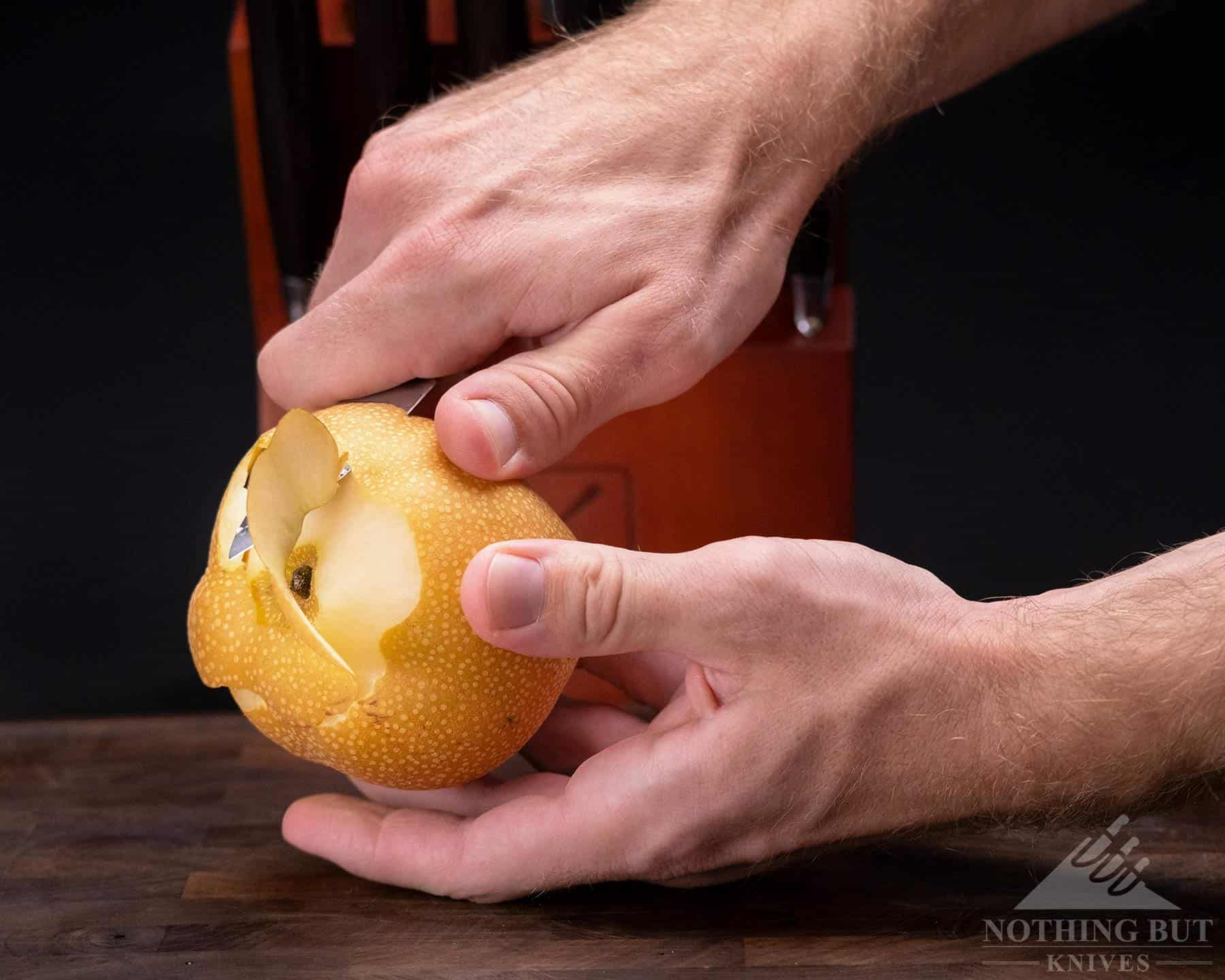 Imarku 16 Piece Japanese Knife Set Review - Image 14 Peeling an Asian pear with the Imarku Japanese paring knife.