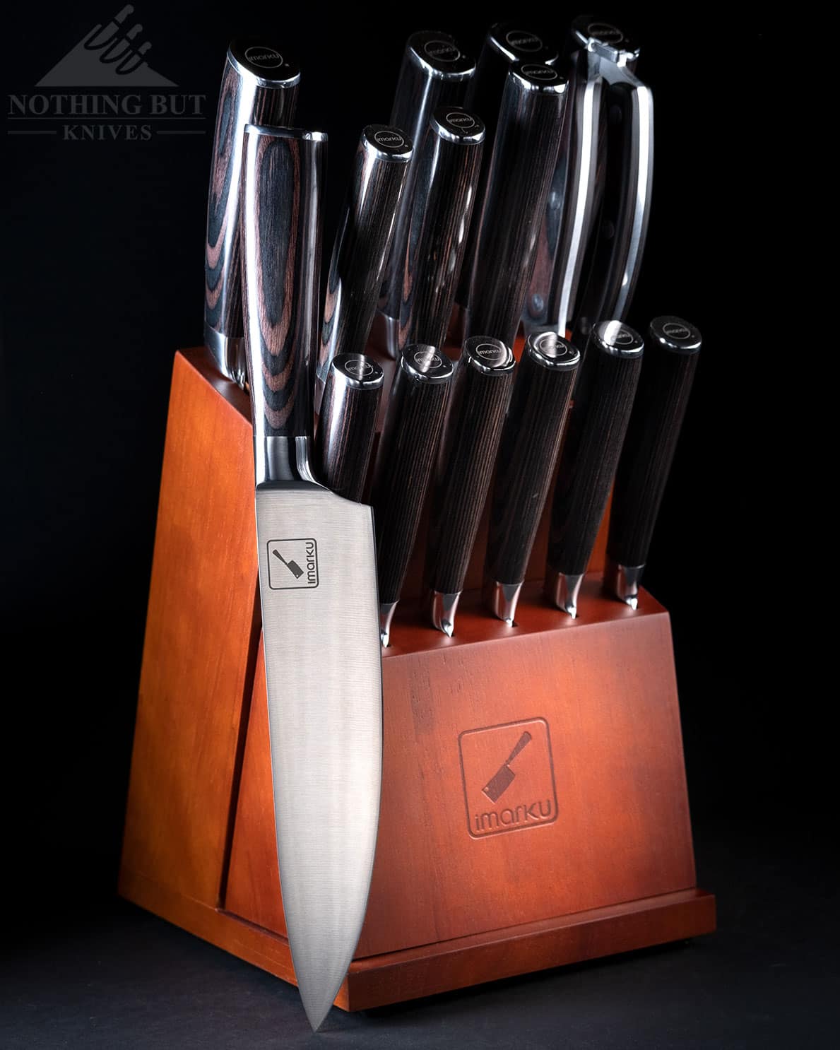 The Imarku 16 Piece Japanese knife set performs above it's price, tag but it has more in common with Western style knife sets than Japanese knives. It is pictured here on a dark background.