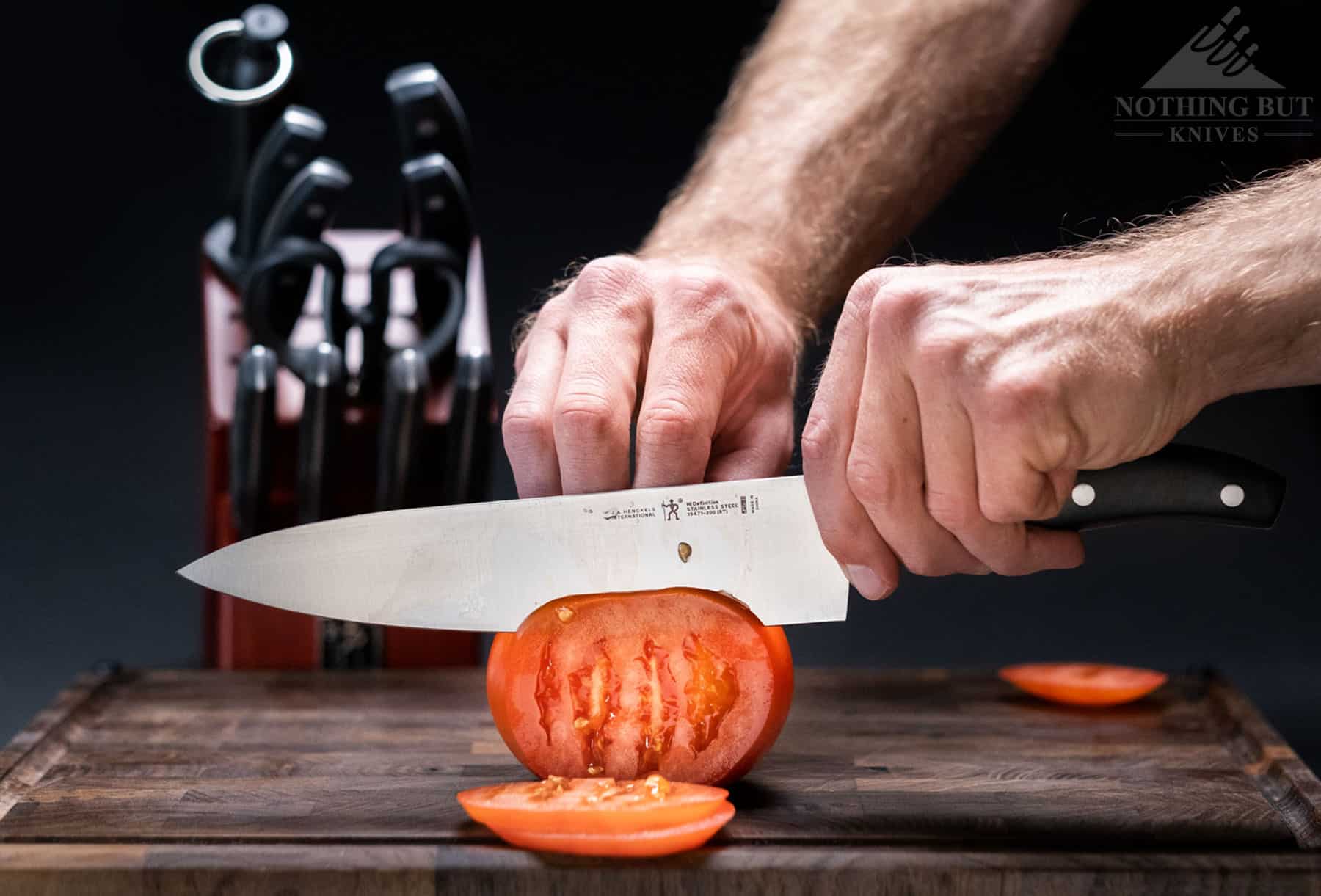 Best Kitchen Knife Sets Under $100 - 2023 Update 12 The 8 inch chef knife that comes with this set offers great performance in this price range. It is pictured here slicing through a tomato.