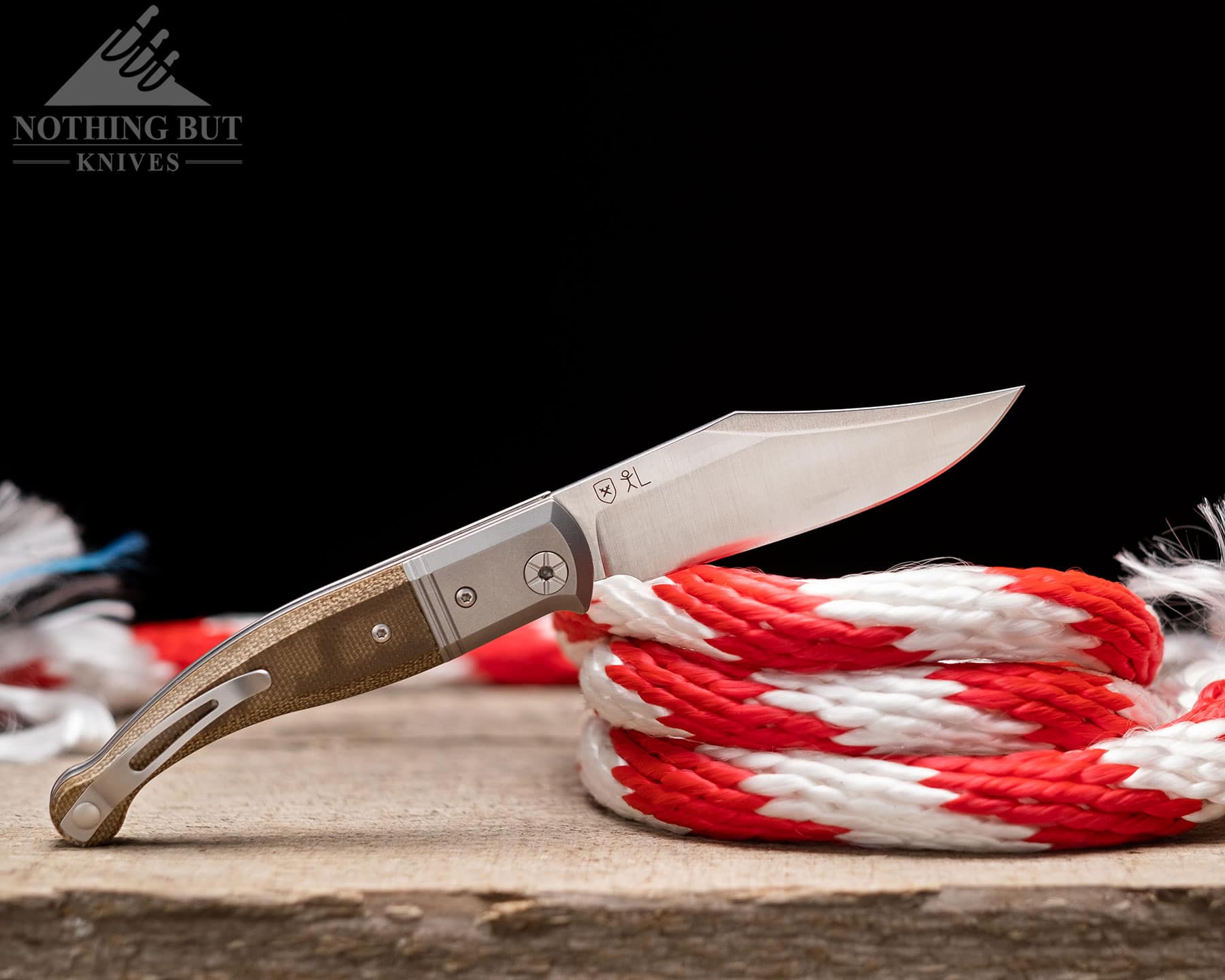 The LionSteel Gitano is a large slip joint with a pocket clip. It is shown here with a rope. 
