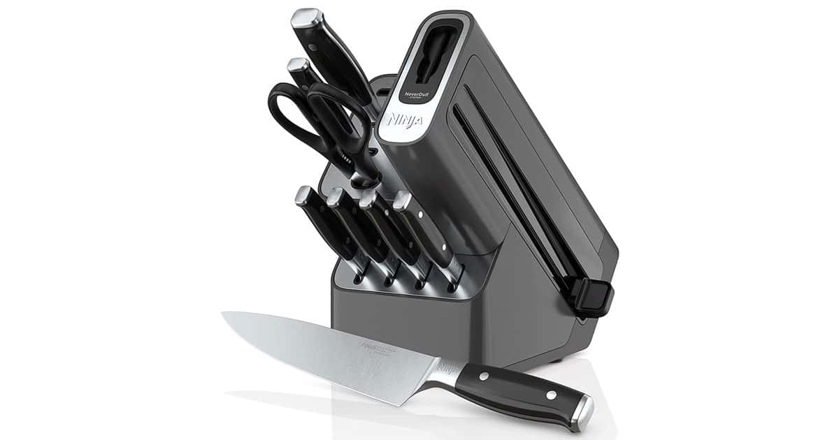 The Nija 32009 Foodi 9-piece knife set with the NeverDull sharpening system on a white reflective background.