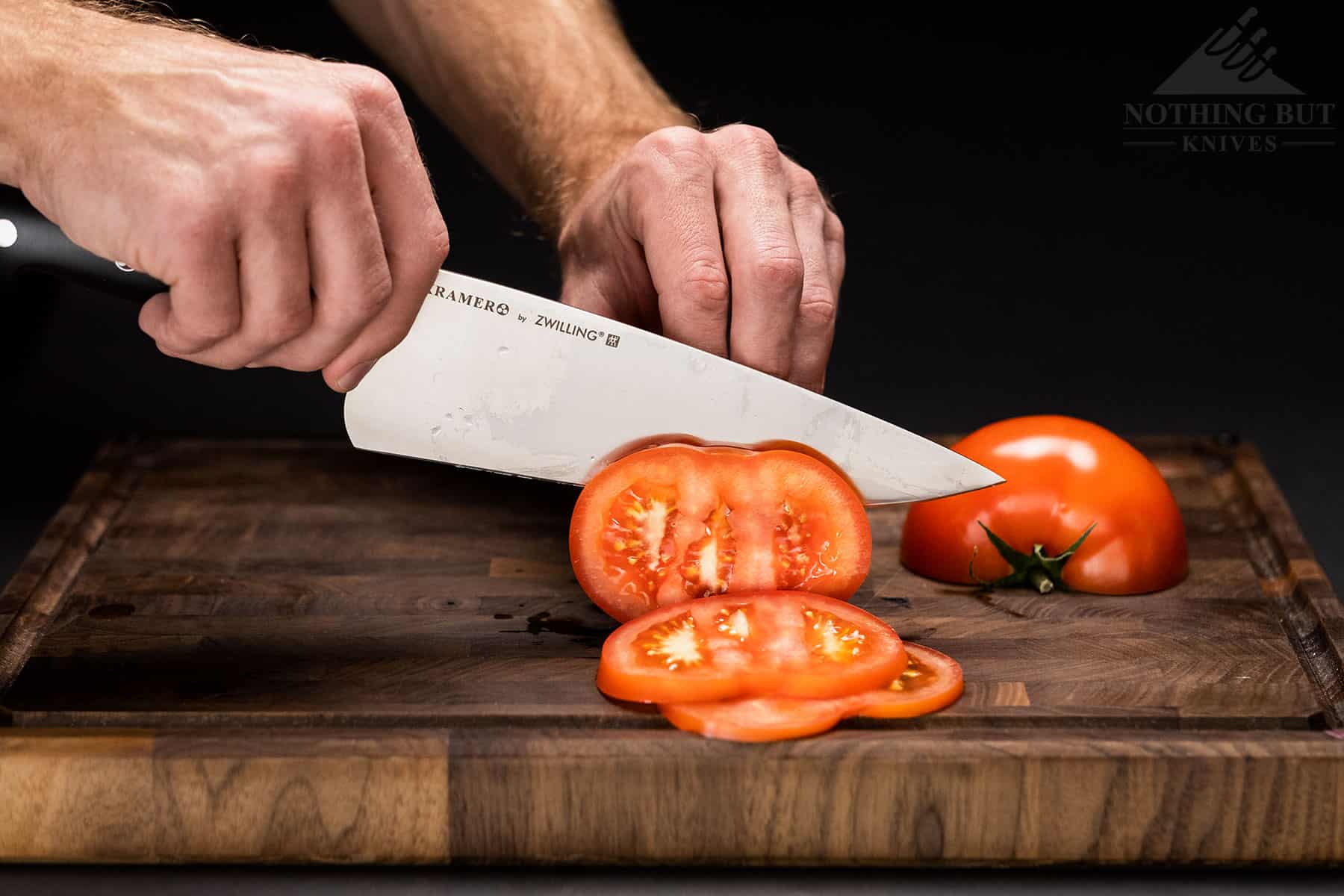 The Ultimate Knife Gift Guide For 2022 46 The Kramer By Zelling chef knife easily cuts thin tomato slices.
