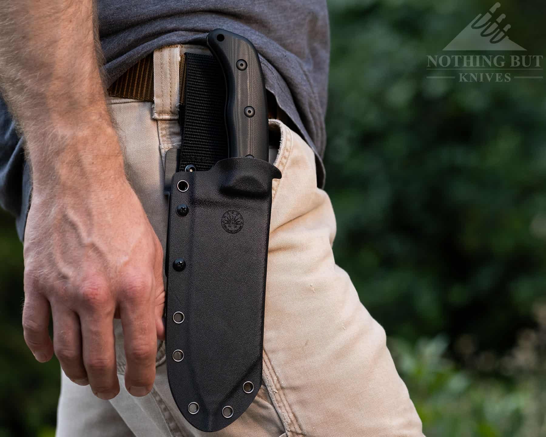 Our Search For The Best Camping Chef Knife - Image 5 The Off-Grid Grizzly V2 shown here on a person's hip in its kydex sheath.
