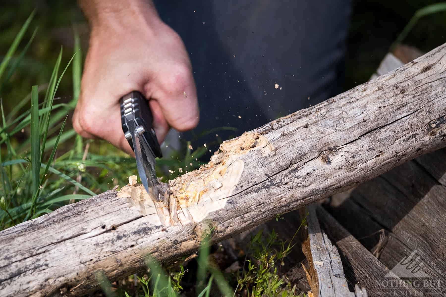The Tri-Ad lock of the Cold Steel 4 MAX Scout is tough enough to withstand chopping as this image shows.