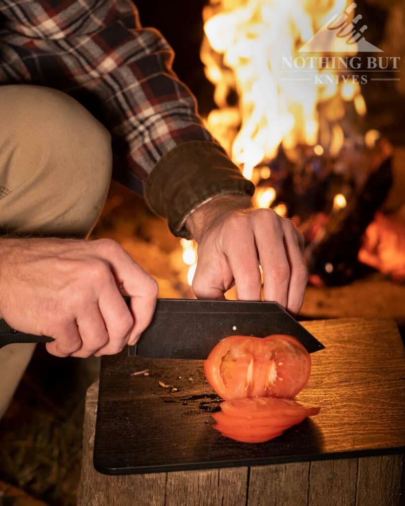 Our Search For The Best Camping Chef Knife 5 Slicing A Tomato At A Campfire