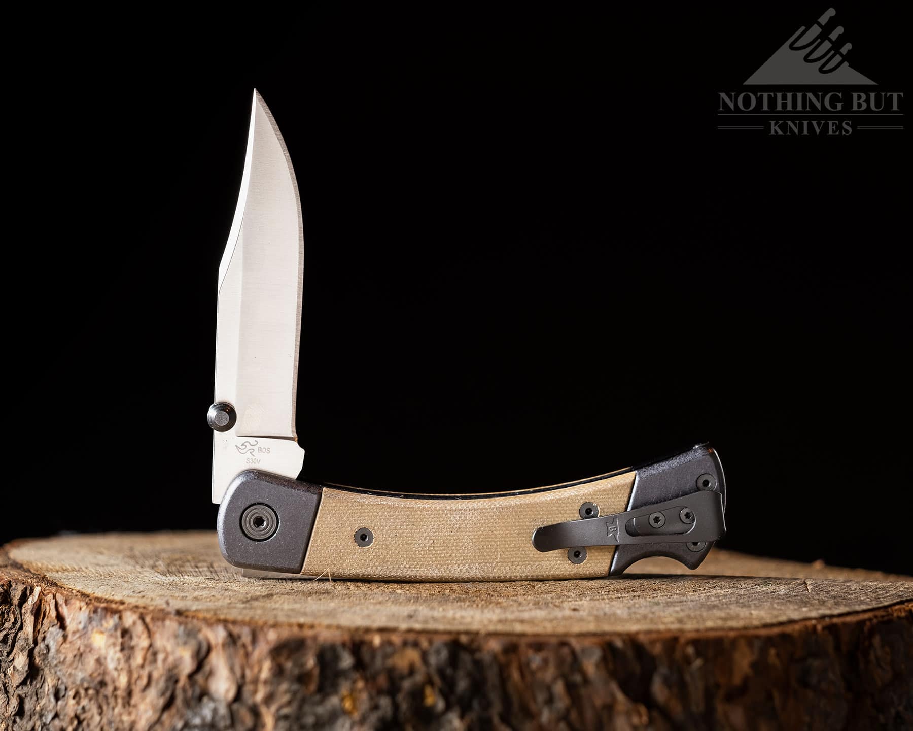 The Buck 110 Hunter Sport in the half open position with the pocket clip facing the camera.
