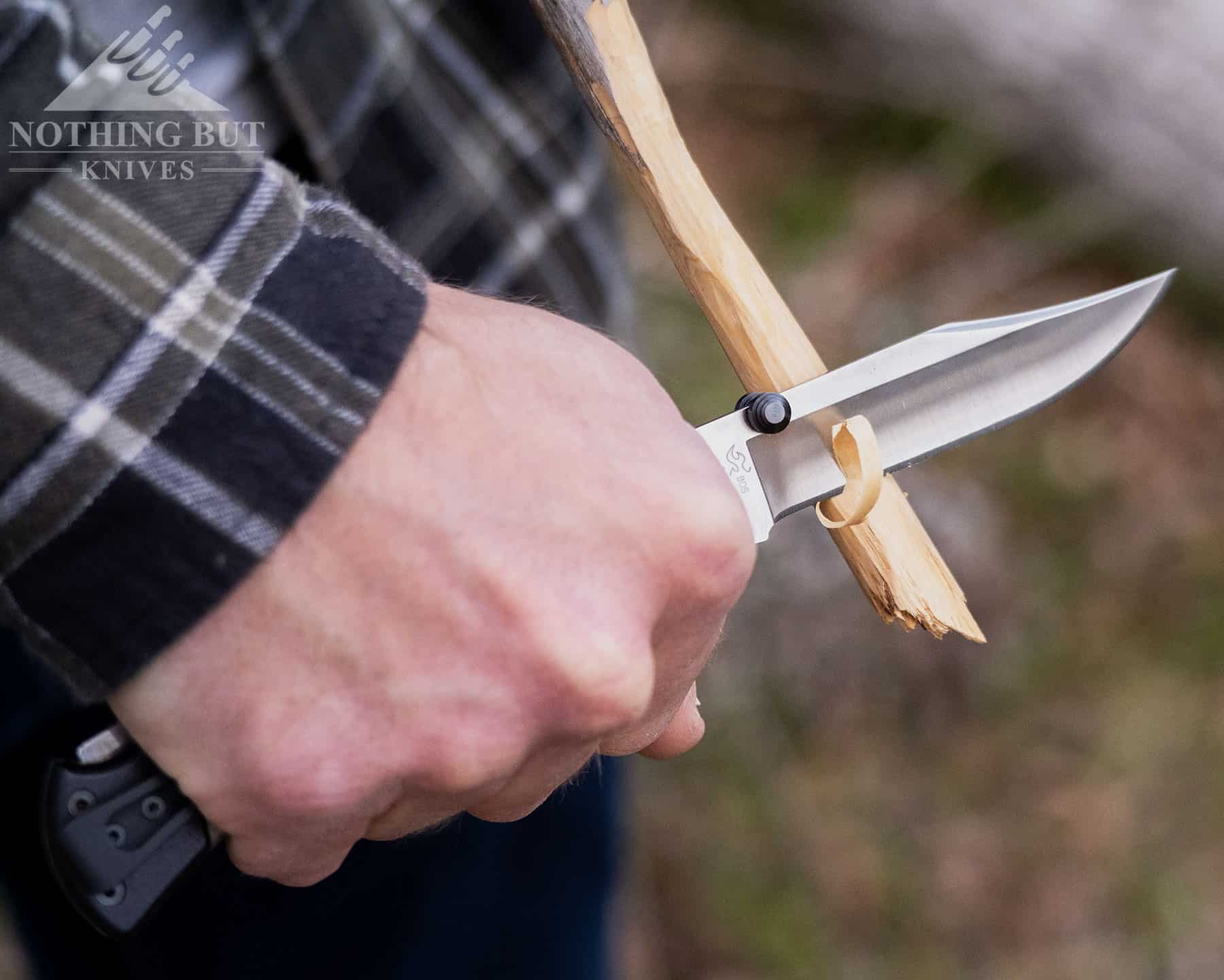 Carving a stick with the Buck 110 Hunter Sport to show it's wood processing ability.