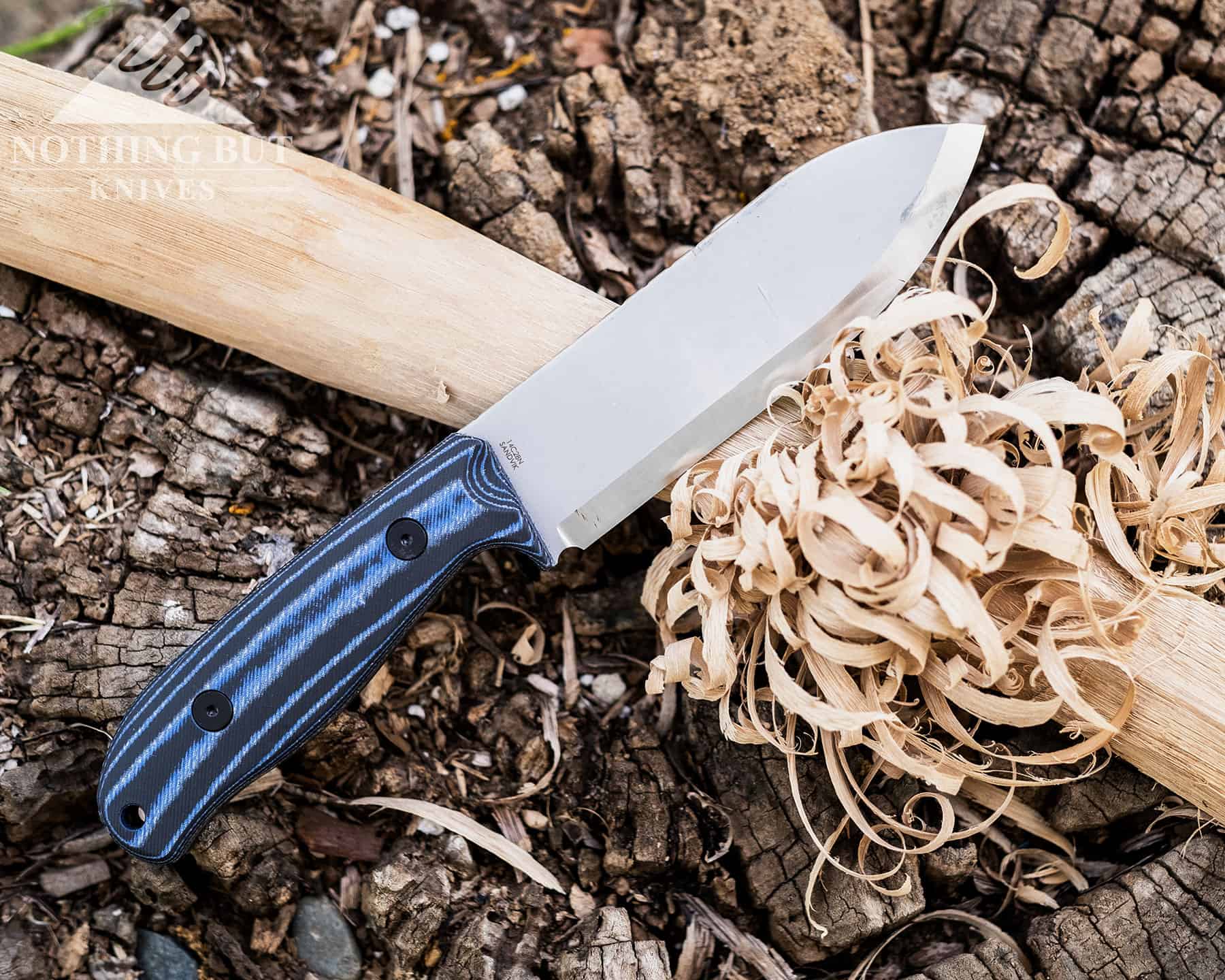 The Off-Grid Ridgeback next to a feather stick that was made with that knife.