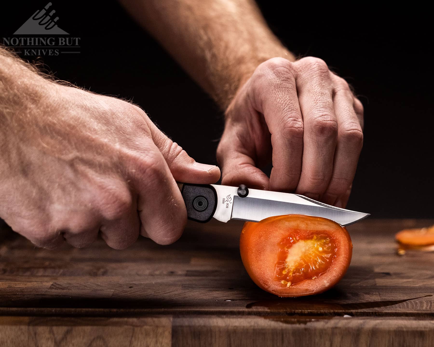 Slicing a tomato with the Buck 110 Hunter Sport to show it's food prep capability. 