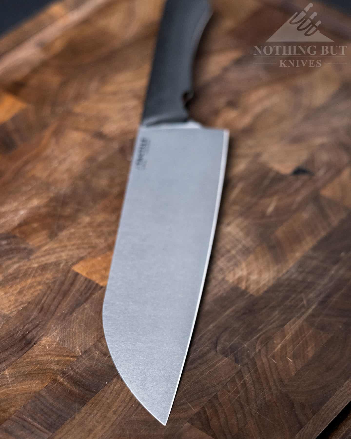 A shallow depth of field image highlighting the blade of the Tactile Santoku Knife.