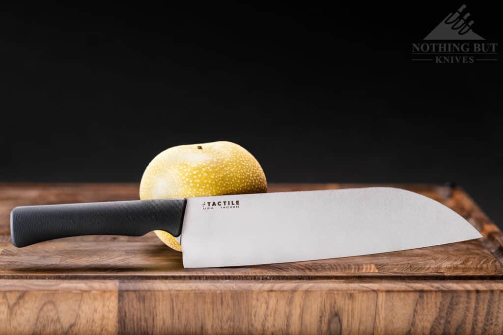 The Tactile Santoku Chef Knife next to a pear to show scale.