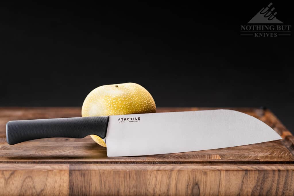 Tactile 8 Inch Santoku Chef Knife Review - Image 1 The Tactile Santoku Chef Knife next to a pear to show scale.