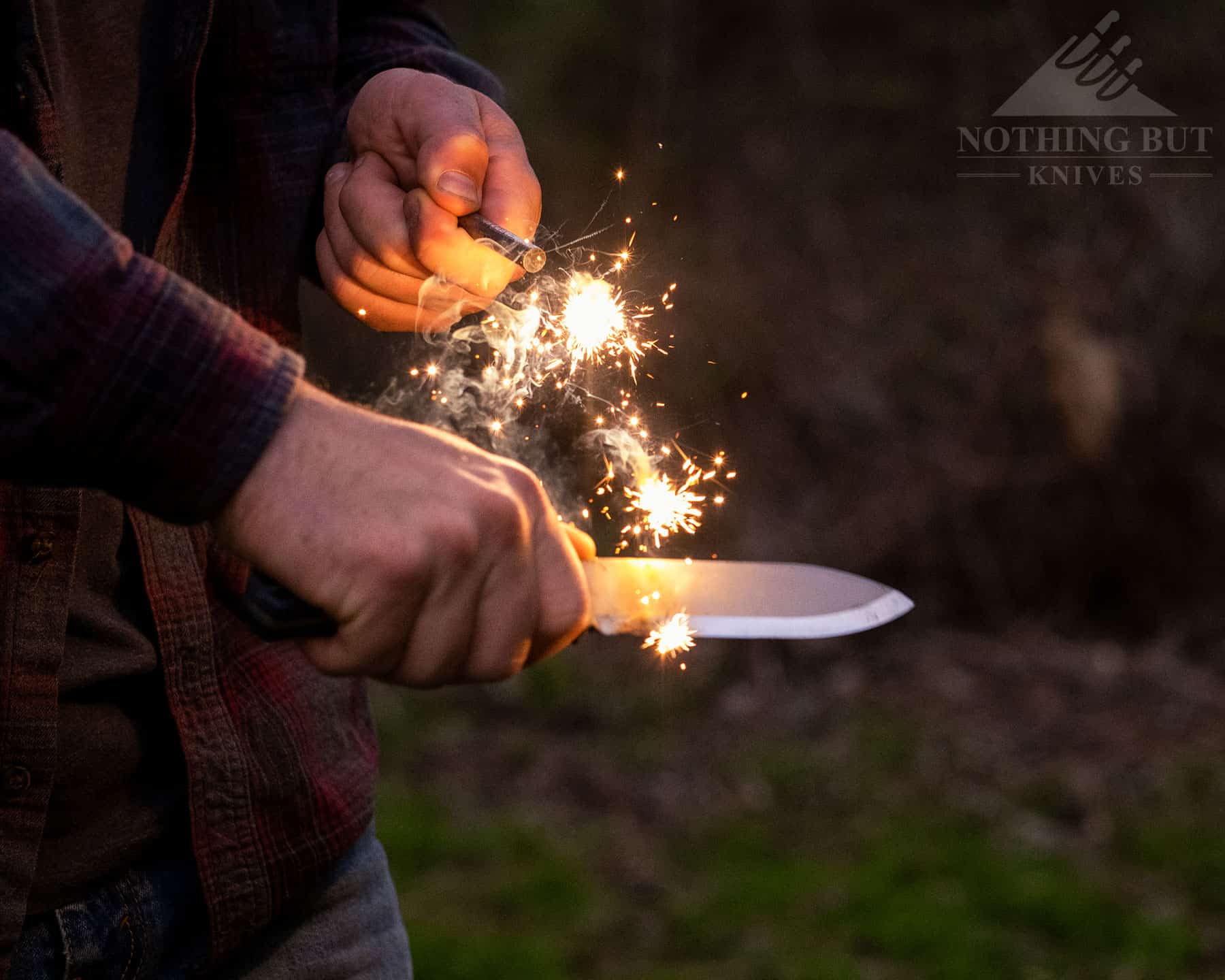 Off Grid Ridgeback Review - Image 14 Throwing spark with a ferro rod and the Off-Grid Ridgeback bushcraft knife.