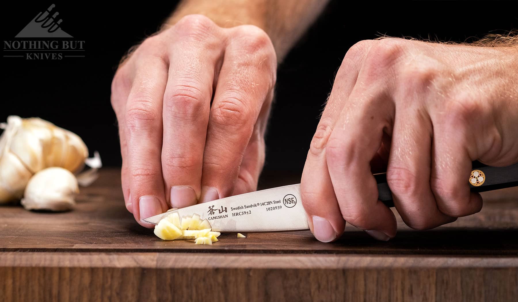 Best Professional And High End Kitchen Knife Sets In 2023 15 Dicing garlic with the Cangshan TC paring knife. This knife is one of our favorites in this cutlery set.