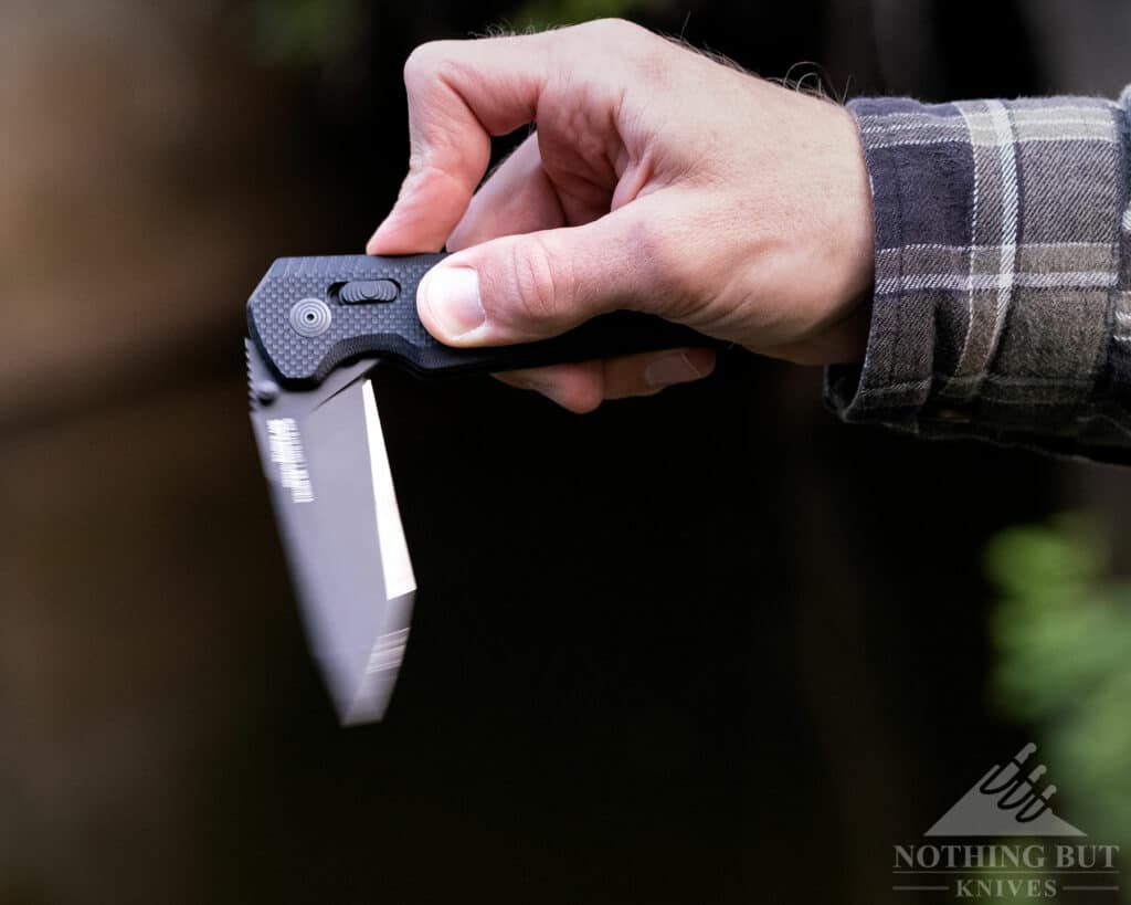 The SOG Vision XR being flipped open using the flipper tab.