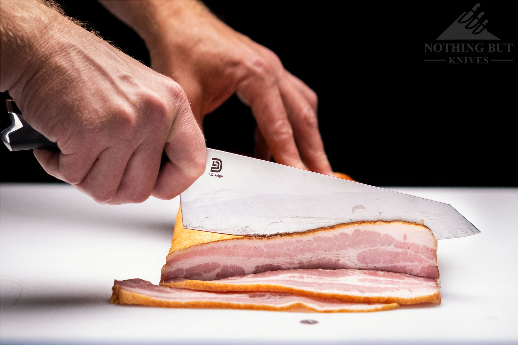 The Vosteed Morgan chef knife struggled a bit when slicing a slab of bacon, but it performed better than most other knives at its price point.