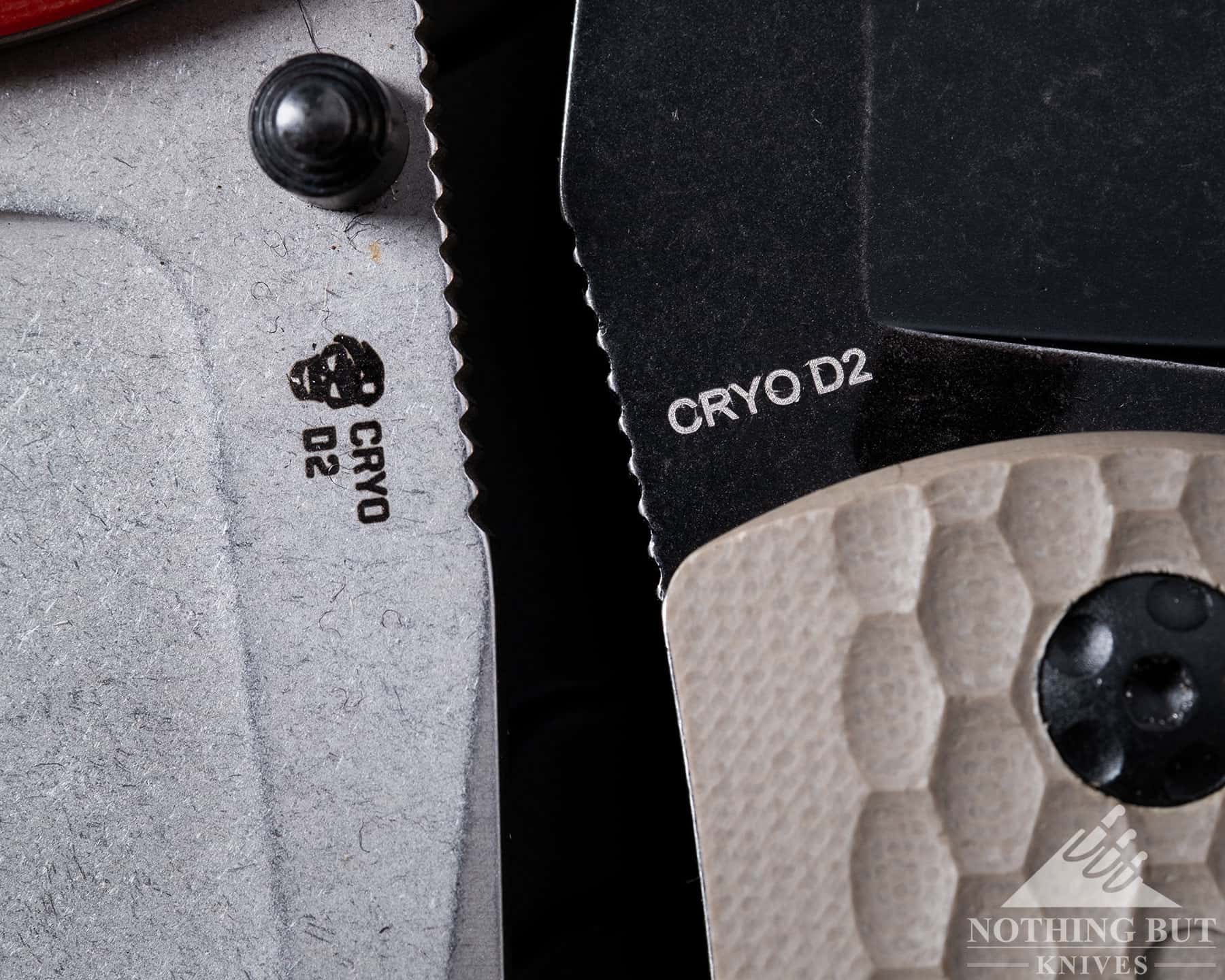 A macro image showing the steel stamps on the blades of two pocket knives.