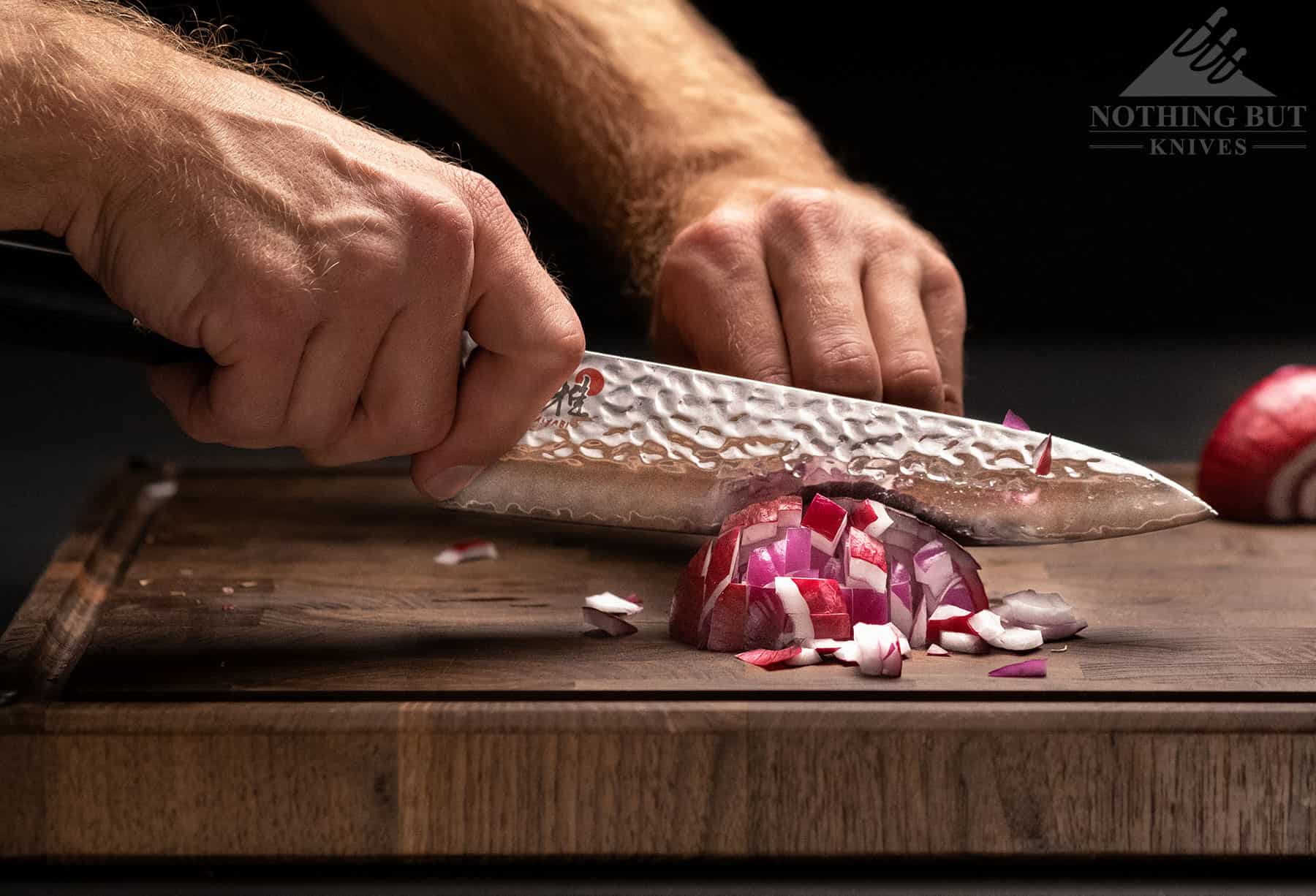 Miyabi Mizu Sg2 8 Inch Chef'S Knife Review - Image 6 The Miyabi Mizu SG2 Japanese chef knife dicing a red onion to show its ability to do detail work.
