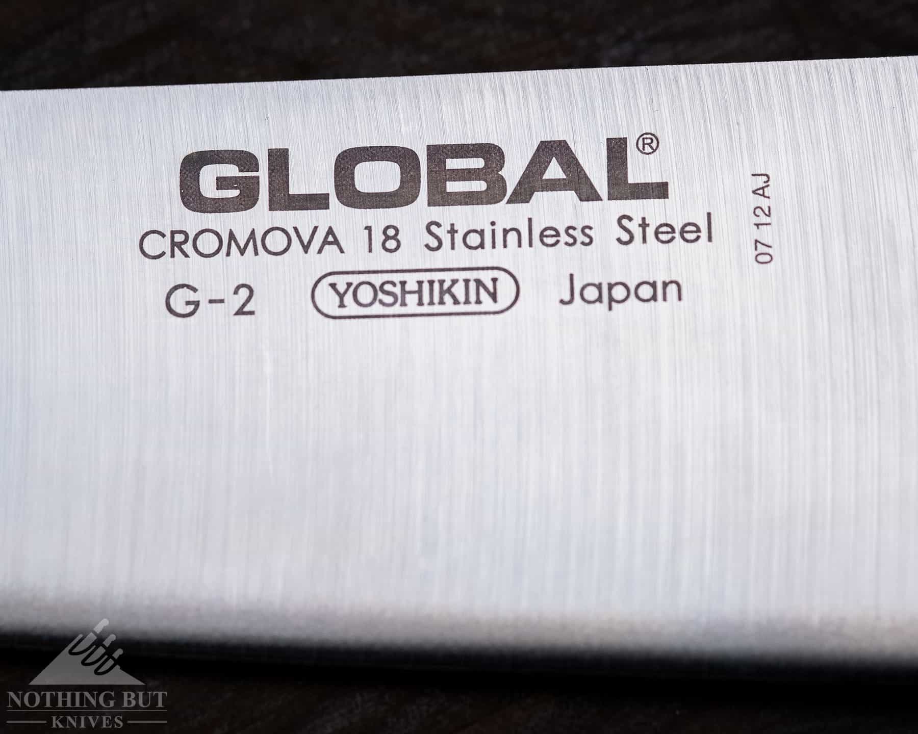 A macro image of the steel stamp on the Global G2 blade to show the steel type used.