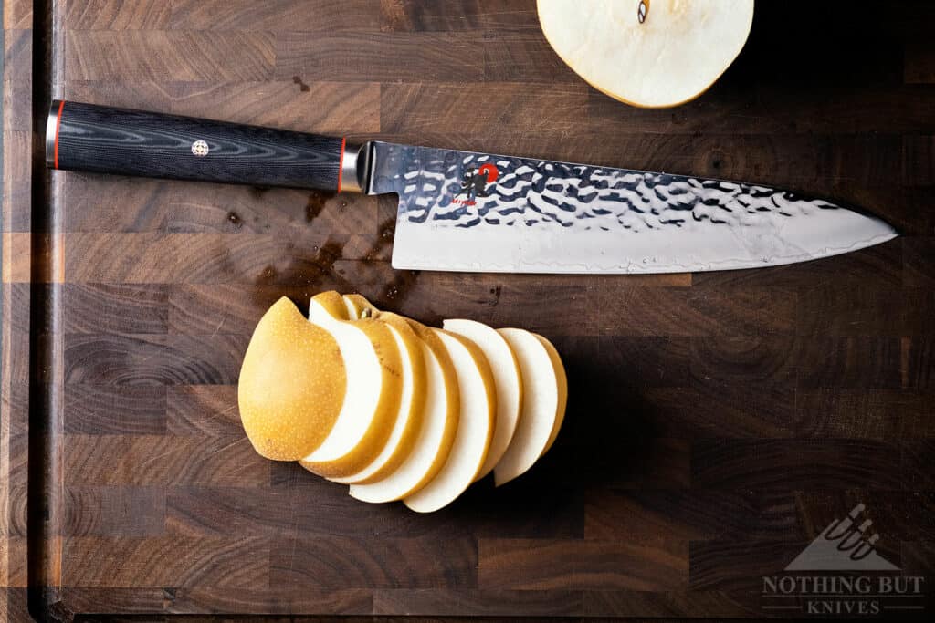 This overhead shot of the Miyabi Mizu SG2 chef knife shows the hammered Damascus powder steel blade.