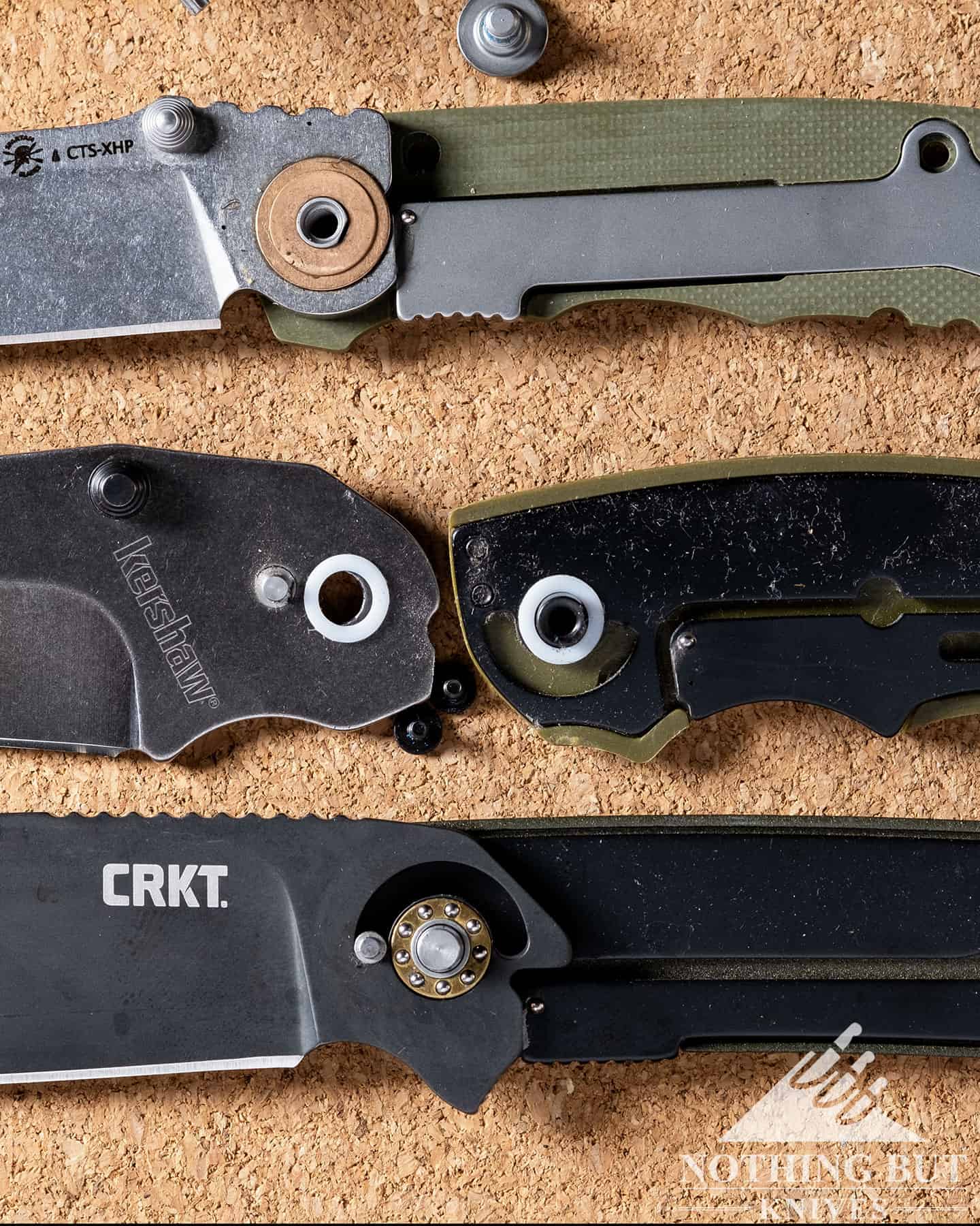 Best Hard Use Pocket Knives Under $50 And $100 - Image 57 Three different disassembled pocket knives with three different pivot types.