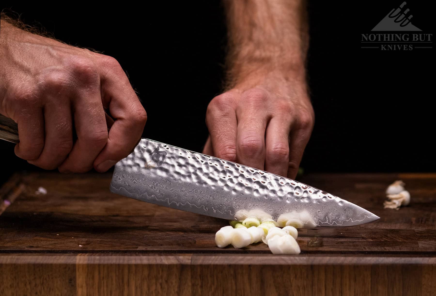 The Shun Premier 8 inch chef knife cuts incredibly well, and it offers something unique as a western style chef’s knife that cuts more like thinner Japanese knives.