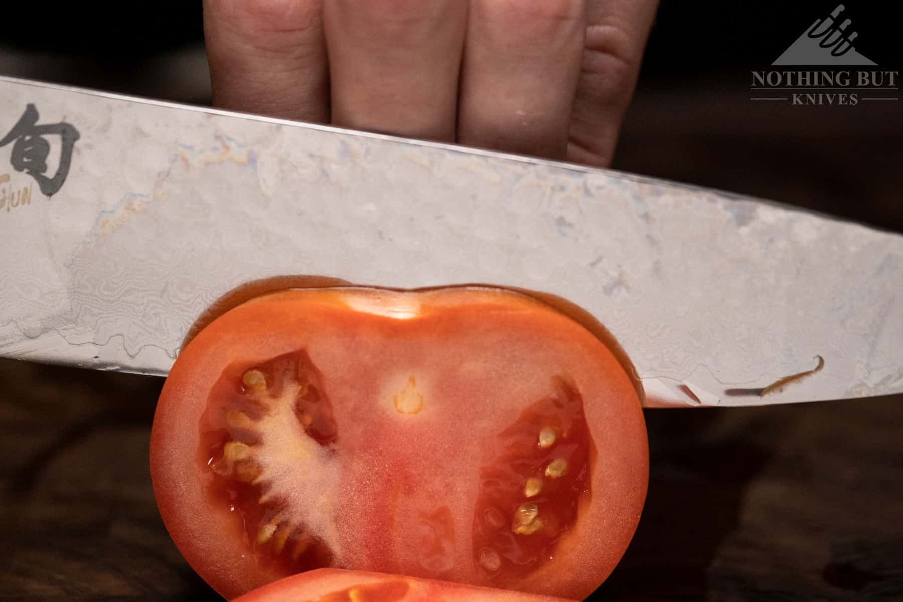 The Shun Premier chef knife had no problem cutting thin tomato slices. 