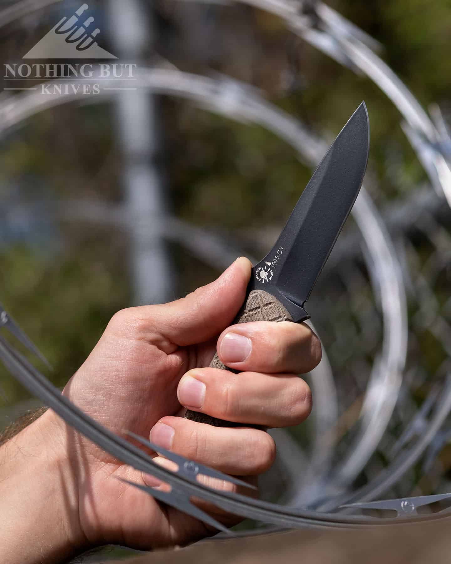 Spartan Blades Alala Knife Review - Image 13 The Spartan Blades Alala looking very tactical in the razer wire.