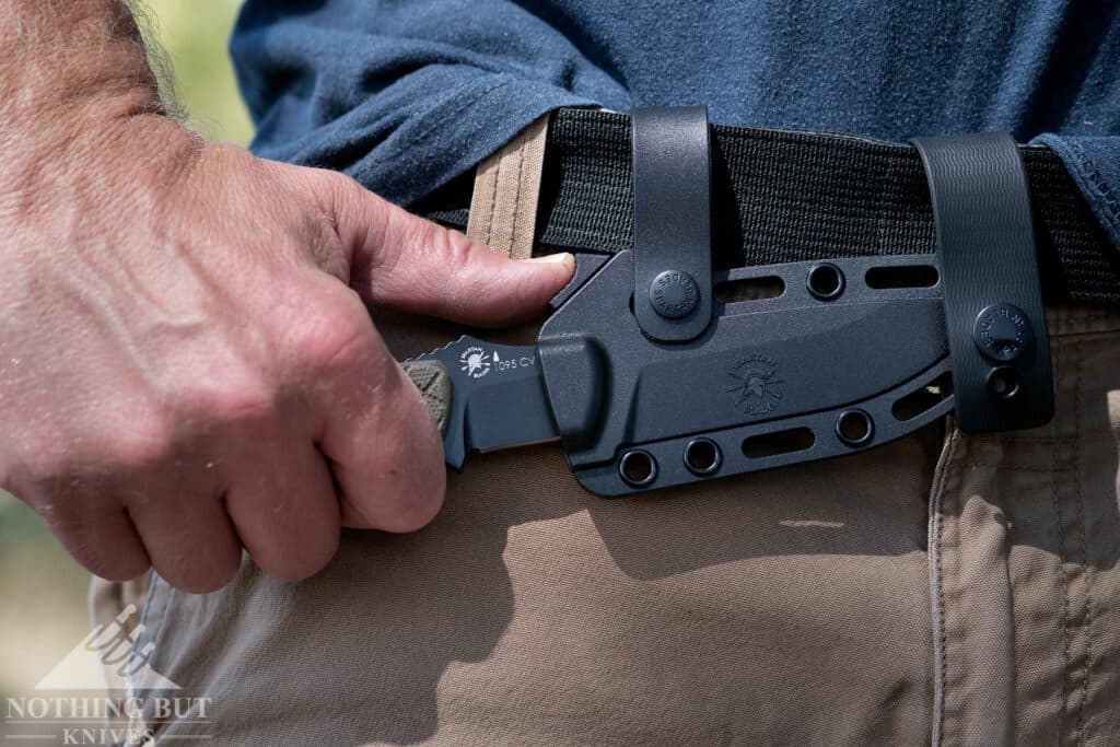 Pushing the release on the Alala's lightweight polymer sheath. 