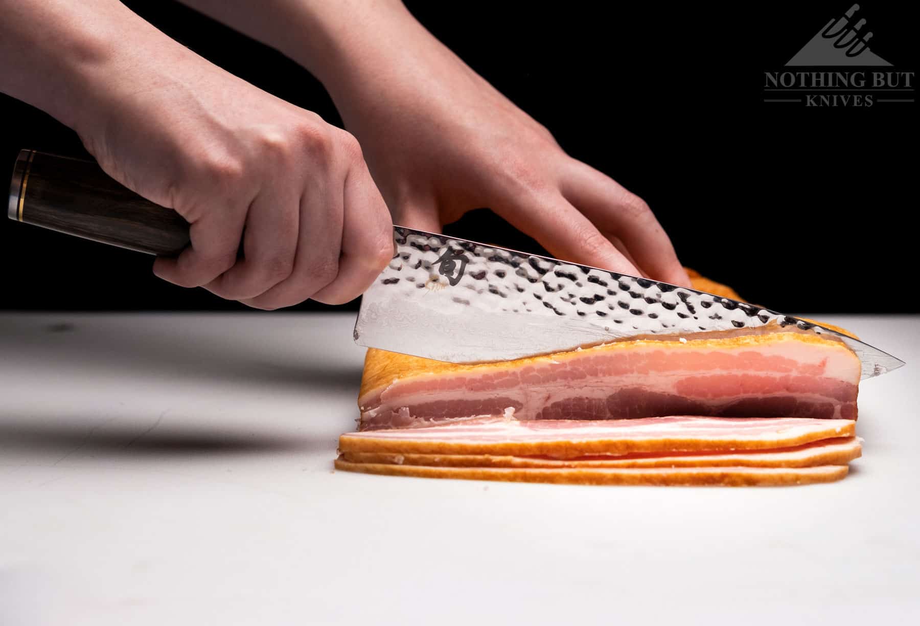 The Shun Premier 8 inch chef knife easily cut thin slices off a slab. bacon
