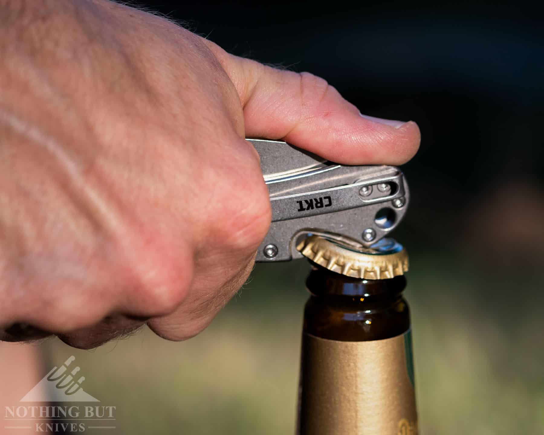 Our Favorite Knives For Opening Beers - Image 9 Our Favorite Knives for Opening Beers - Image 5: CRKT Bev Edge Opening A Beer Bottle
