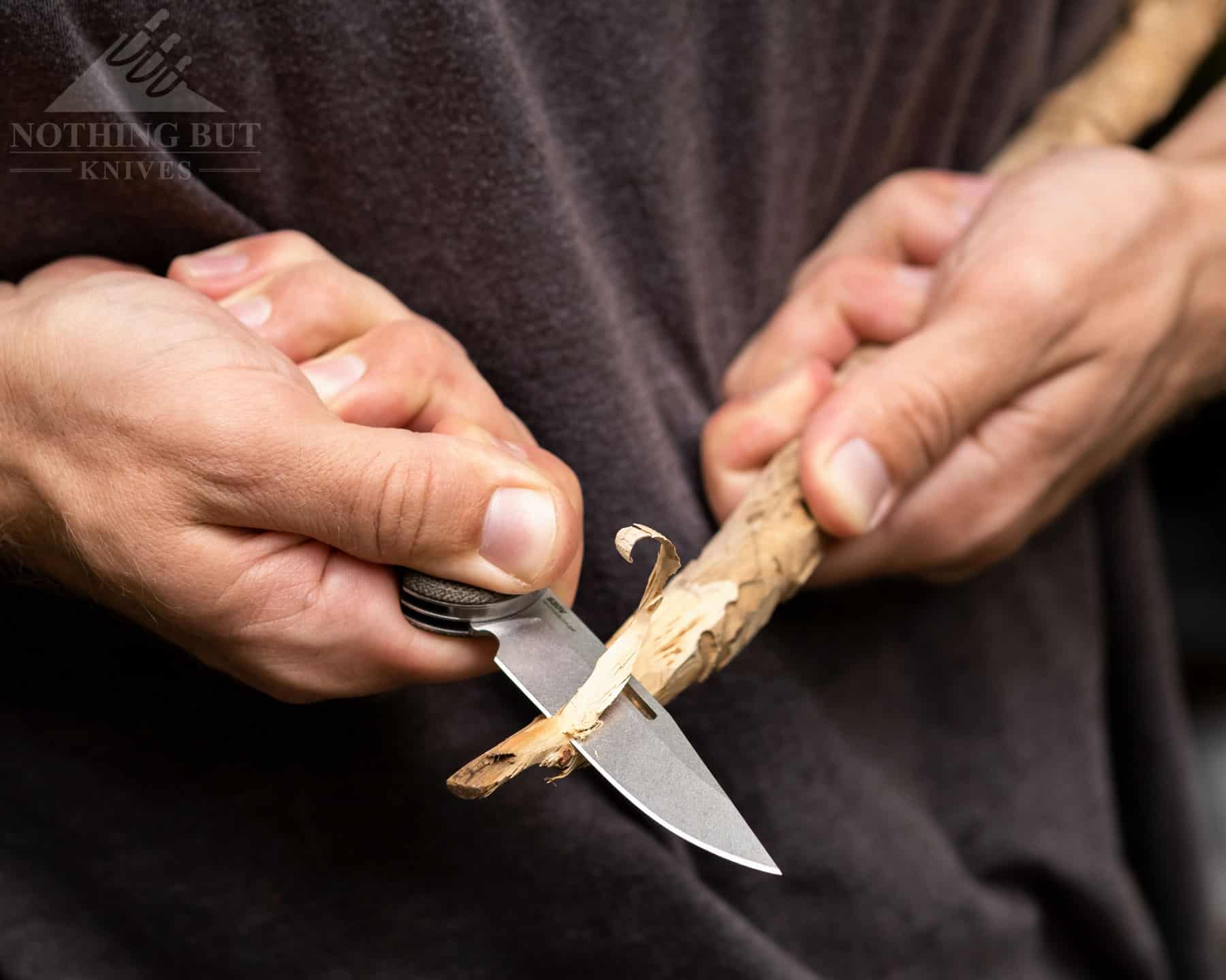 The three inch blade of the weekender has a toothy gring that carves up wood easily.