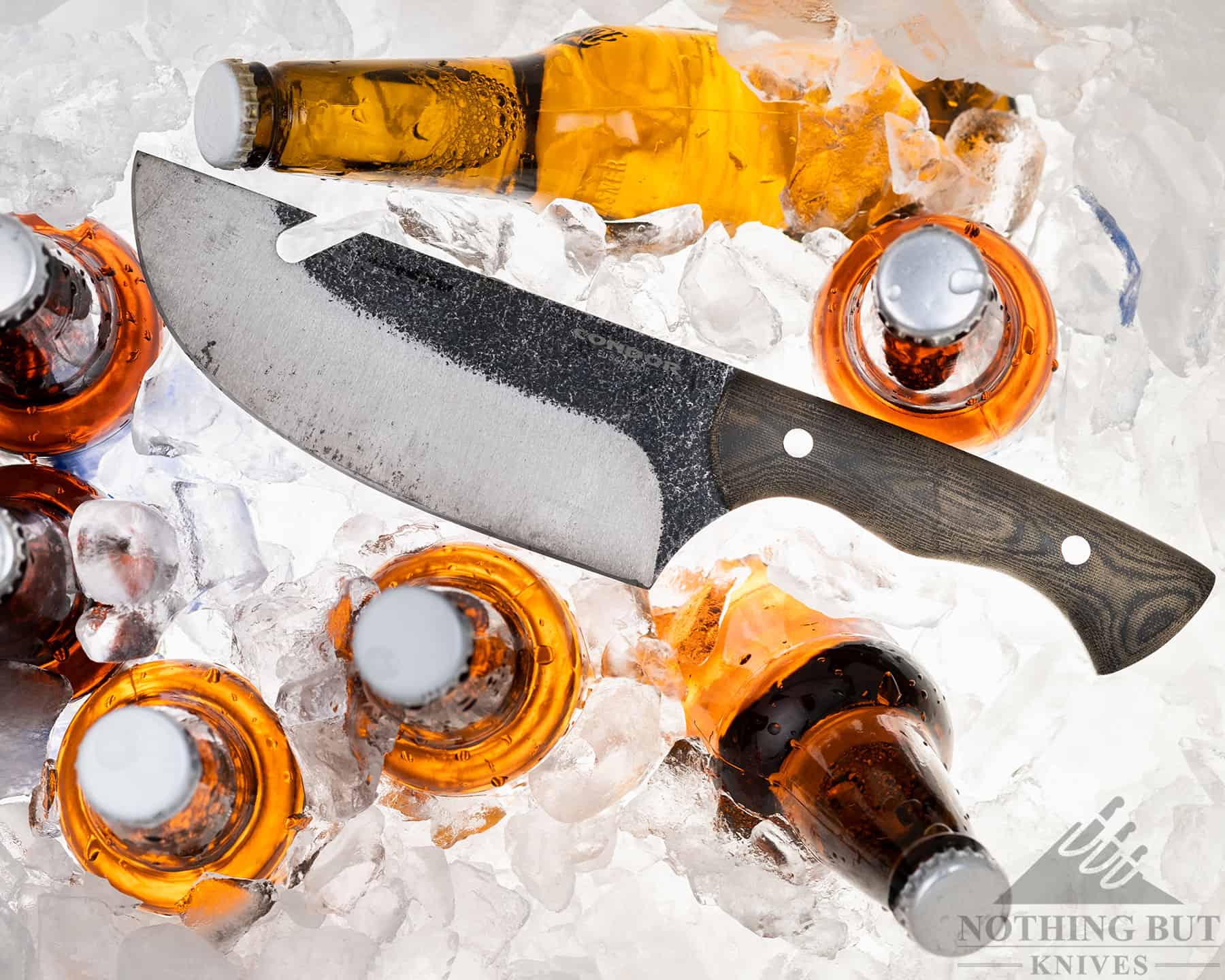 The Condor Bush Slicer has a notch on the blade for pulling pots off a campfire. This notch is handy for opening beer bottles.