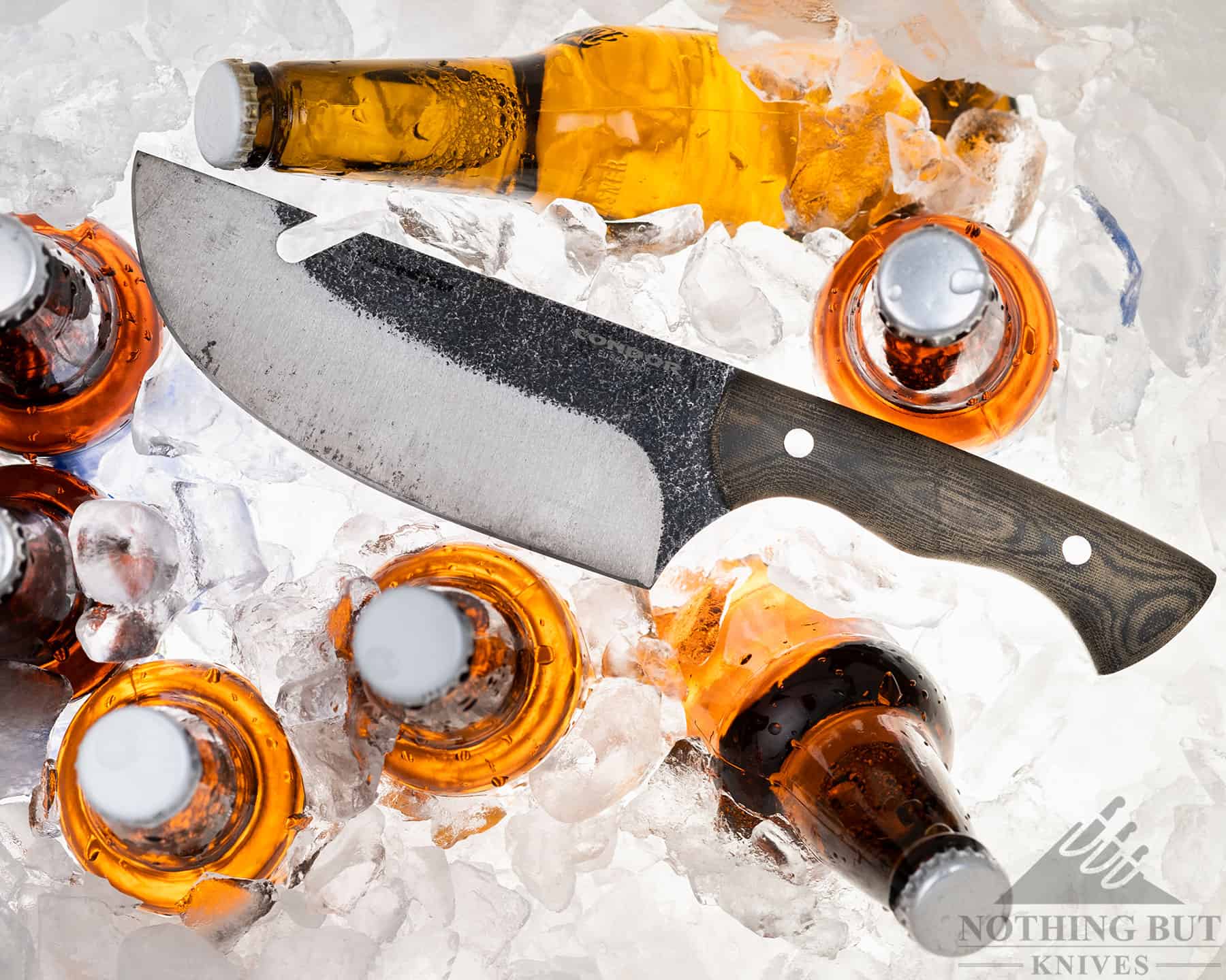 Our Favorite Knives For Opening Beers - Image 16 The Condor Bush Slicer has a notch on the blade for pulling pots off a campfire. This notch is handy for opening beer bottles.