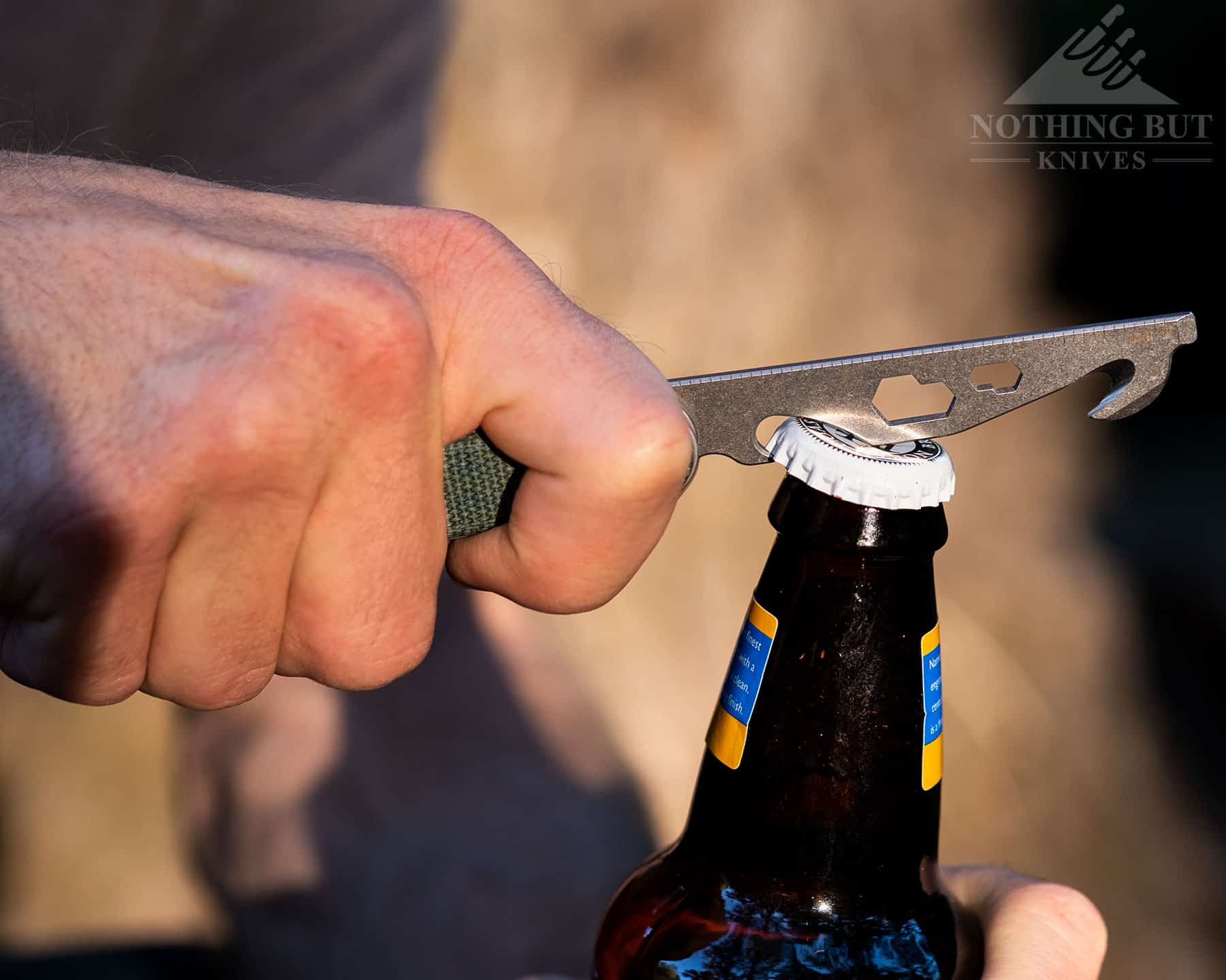 Our Favorite Knives For Opening Beers - Image 3 Our Favorite Knives for Opening Beers - Image 2: Lifting A Bottle Cap With The Civivi Crit
