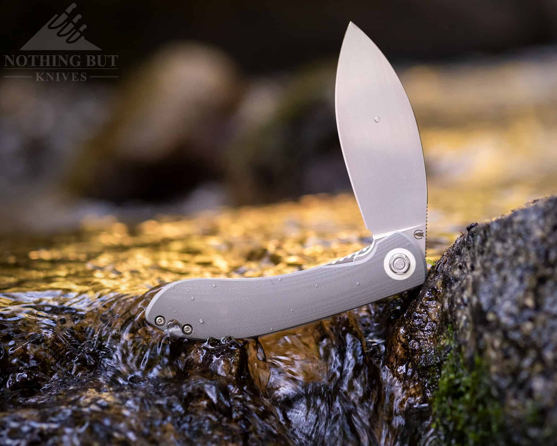 The Vosteed Nightshade Grey has a 154CM steel blade, caged ball bearings and G-10 handle scales.