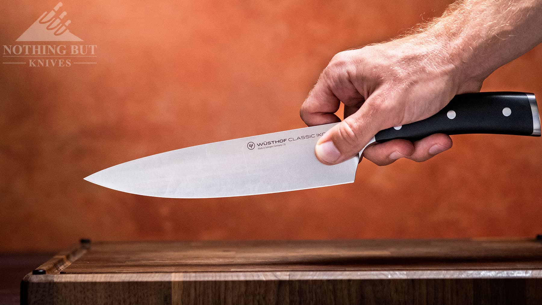 The eight inch Classic Ikon chef knife balance ishandle heavy. 