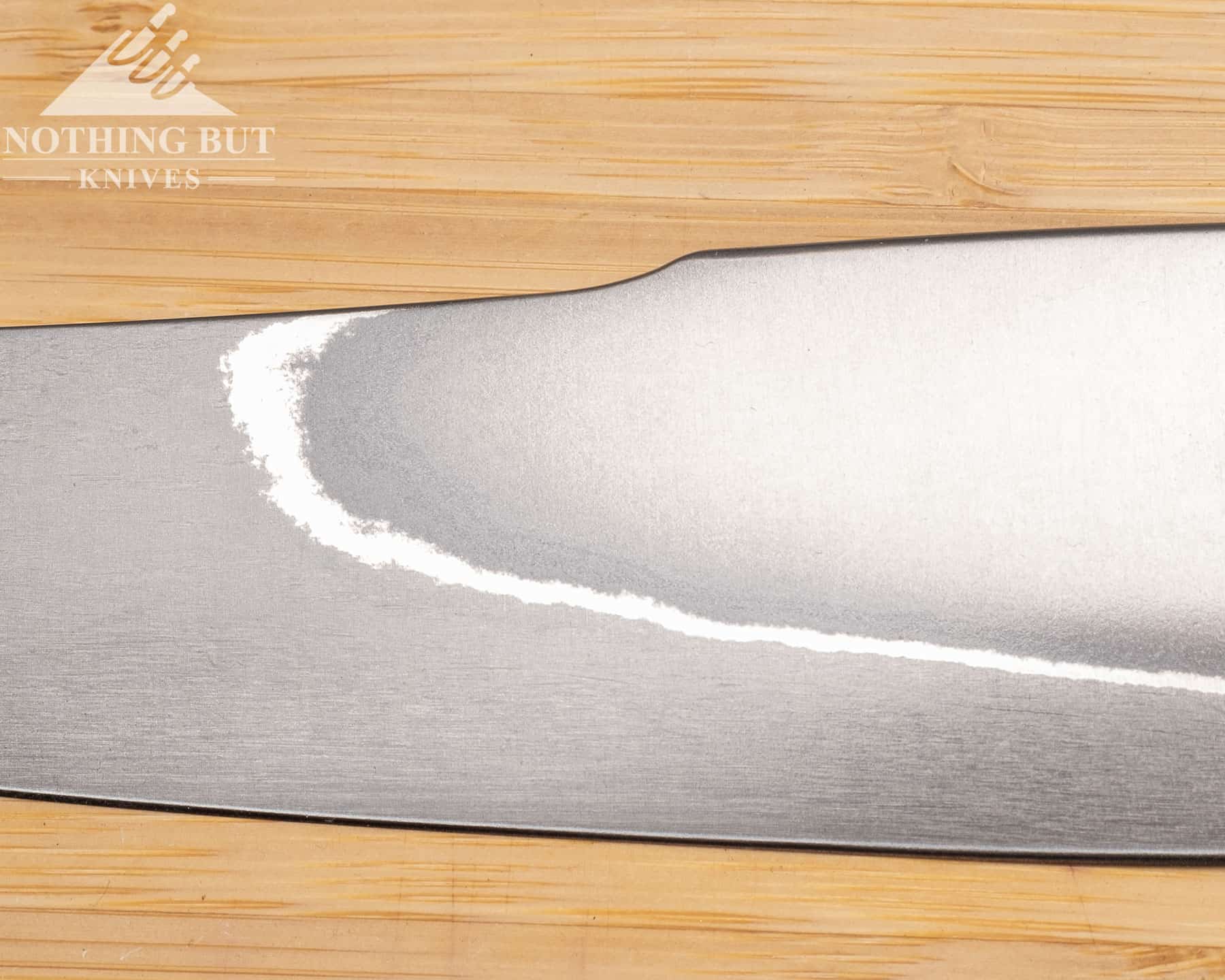 The blade dip on the spine of the Xin Cutlery XinCraft petty chef knife serves a purpose beyond aesthetics. 