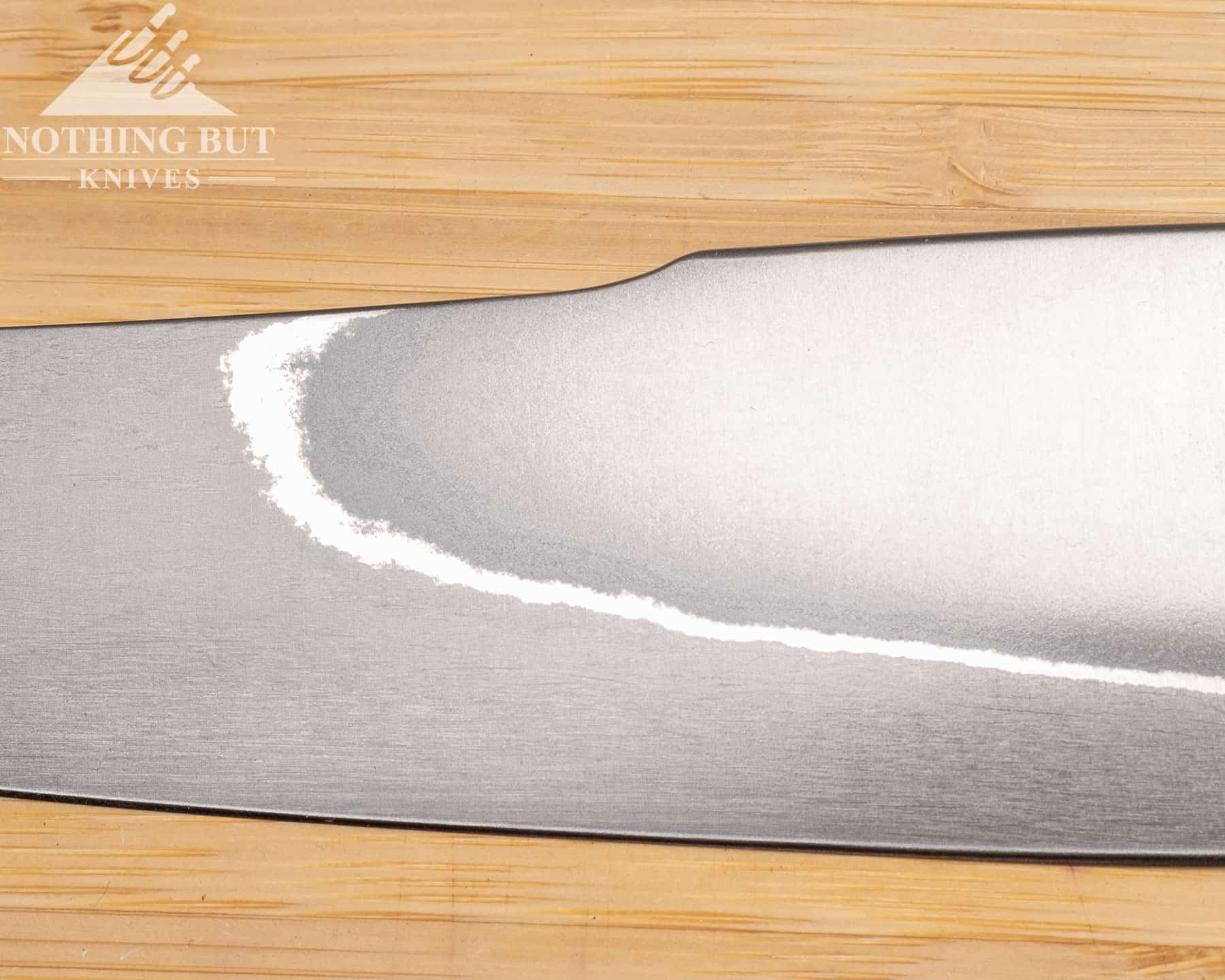 Xin Cutlery Xincraft 8.4&Quot; Chef'S Knife Review - Image 6 The blade dip on the spine of the Xin Cutlery XinCraft petty chef knife serves a purpose beyond aesthetics.