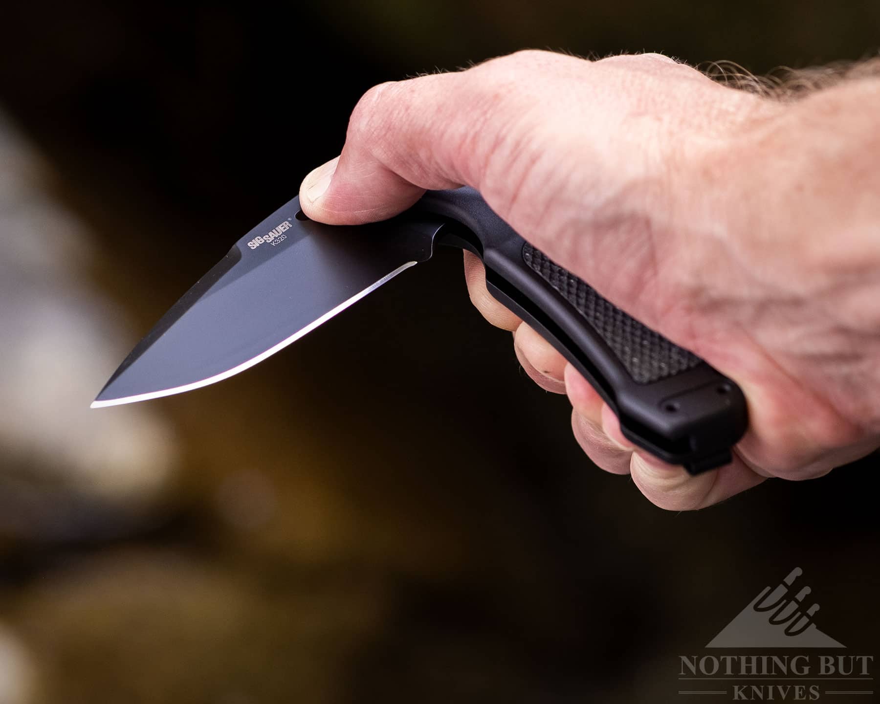 Testing the action of the Hogue Sig K320 folding knife. 